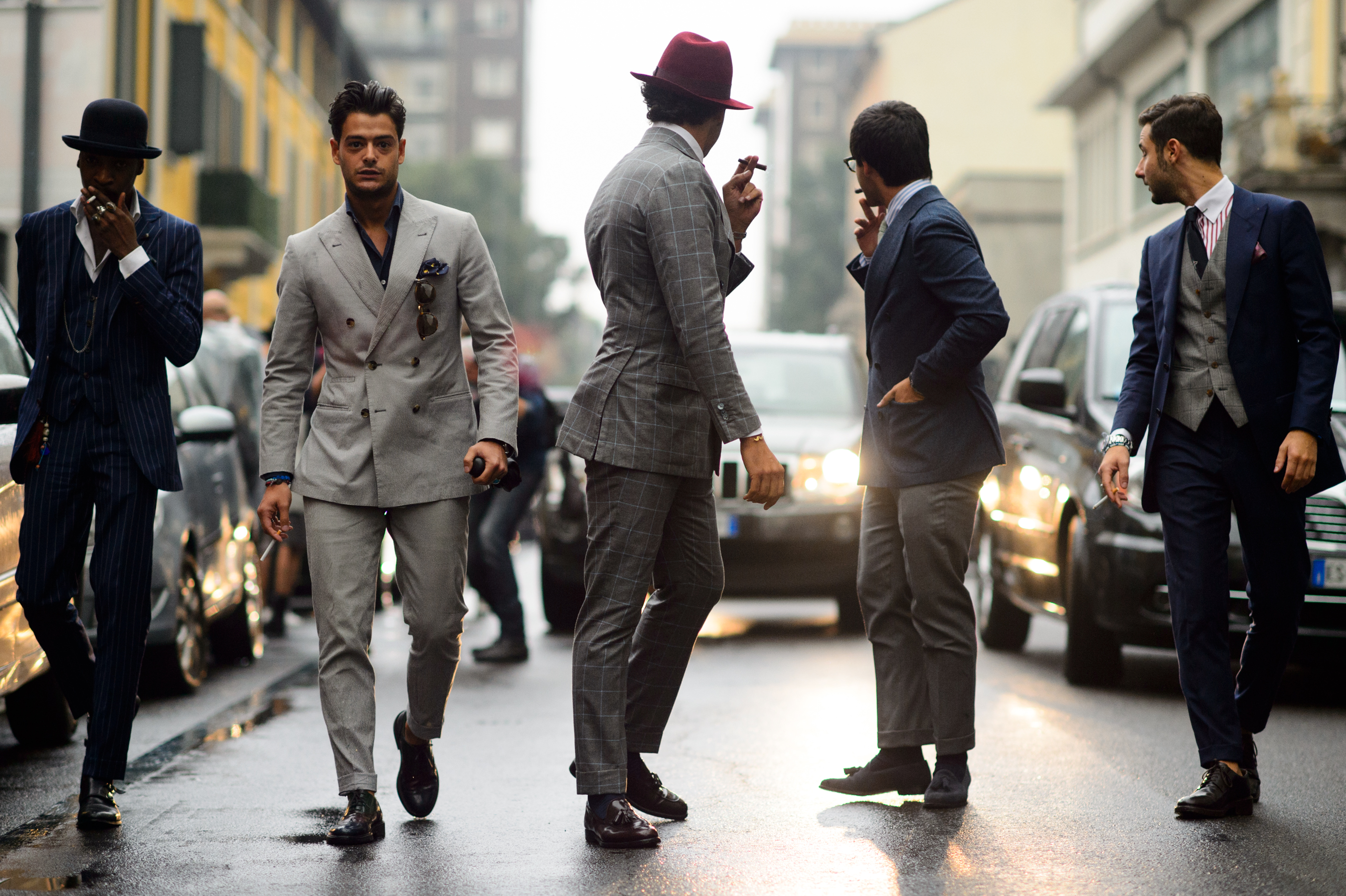 Five Italian men in suits on the street