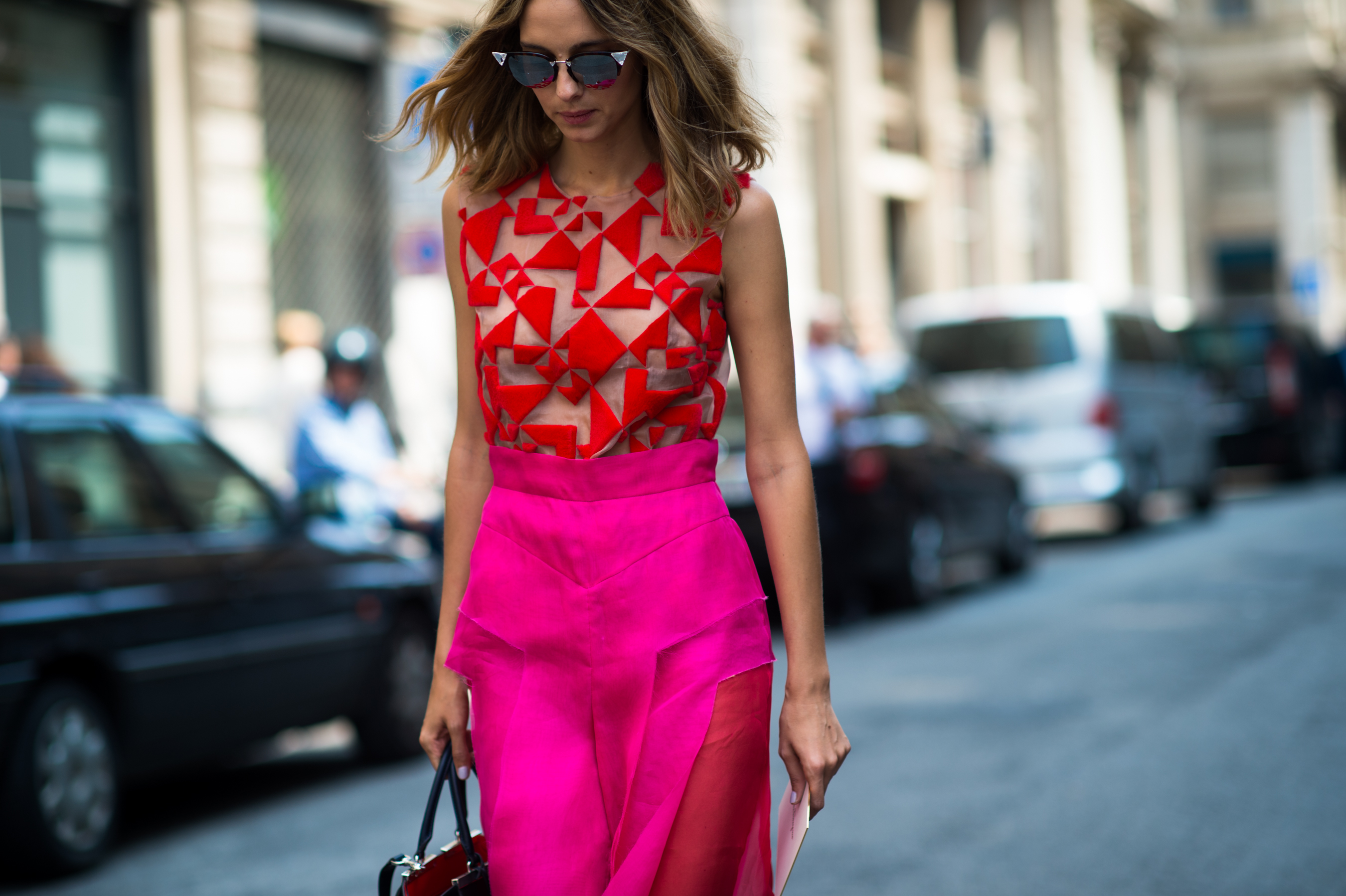 Argentinian woman wearing red and pink outfit