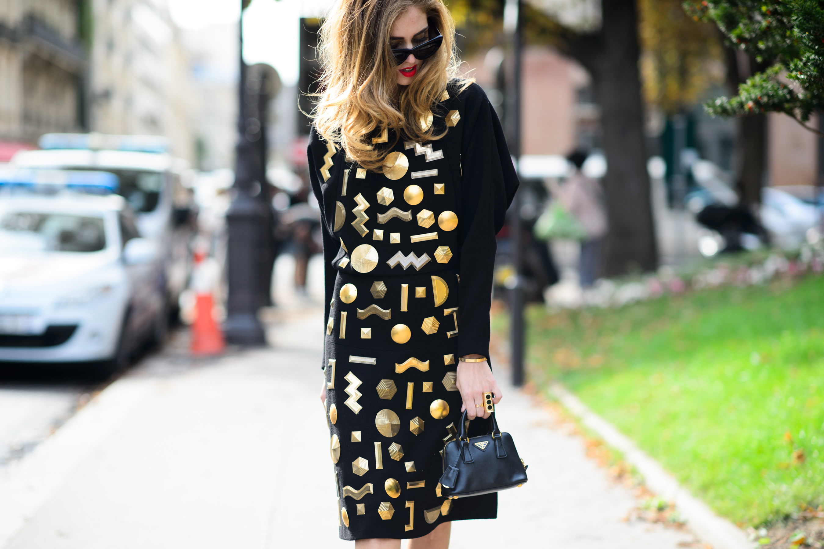 Italian blogger wearing dress with golden detail