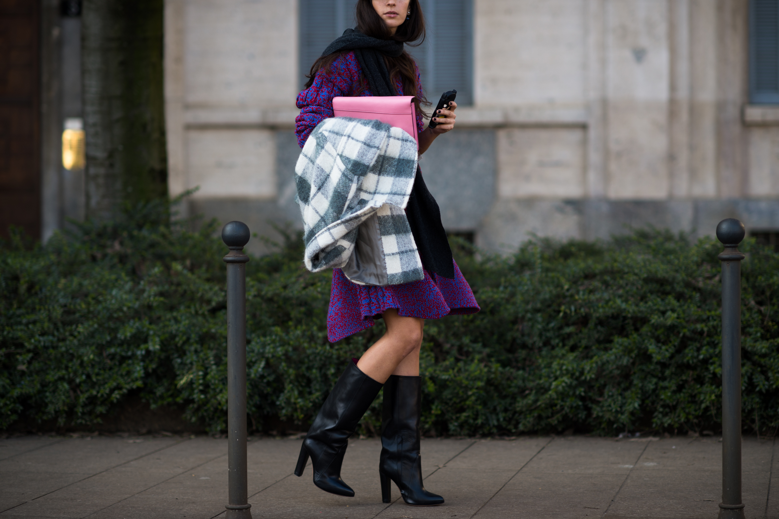 Italian woman wearing purple dress and tall boots