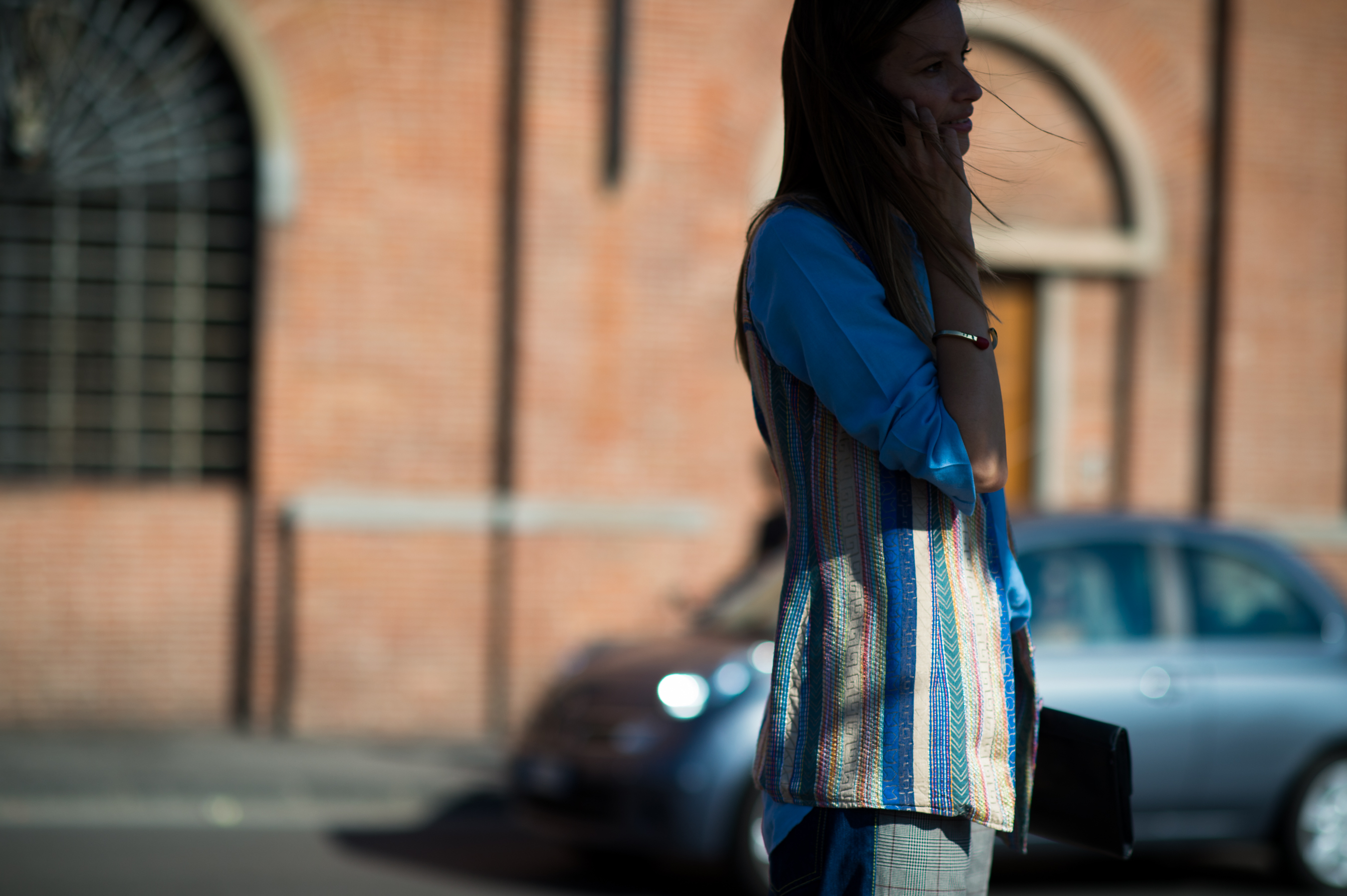 Italian woman wearing blue patchwork jacket