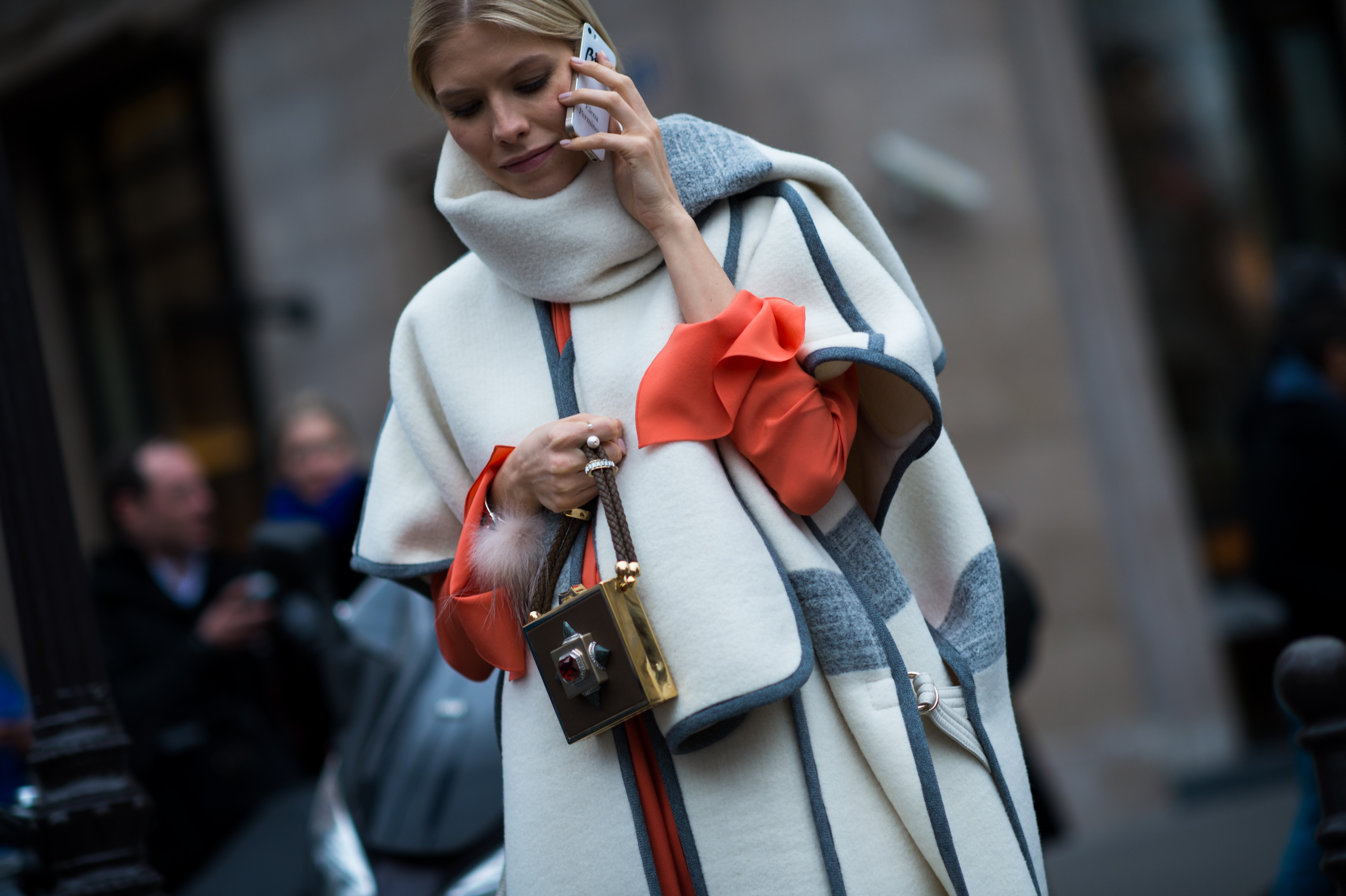 Russian woman wearing white poncho