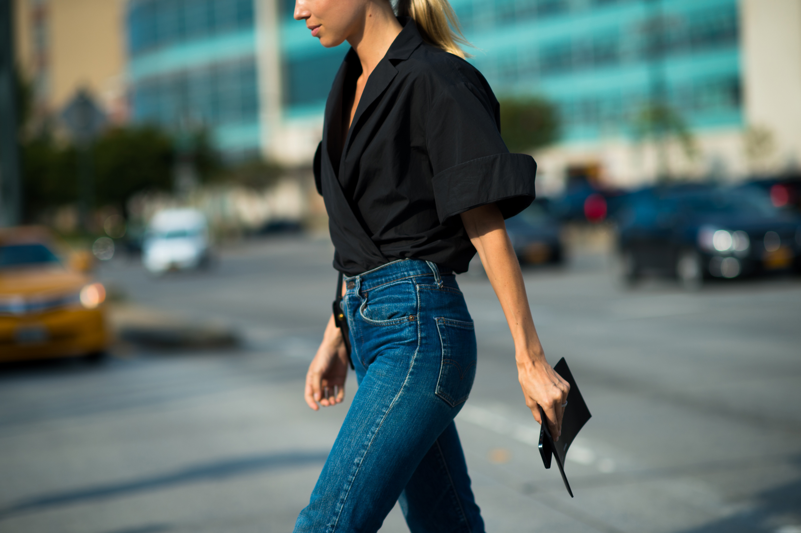 Woman wearing black shirt and denim