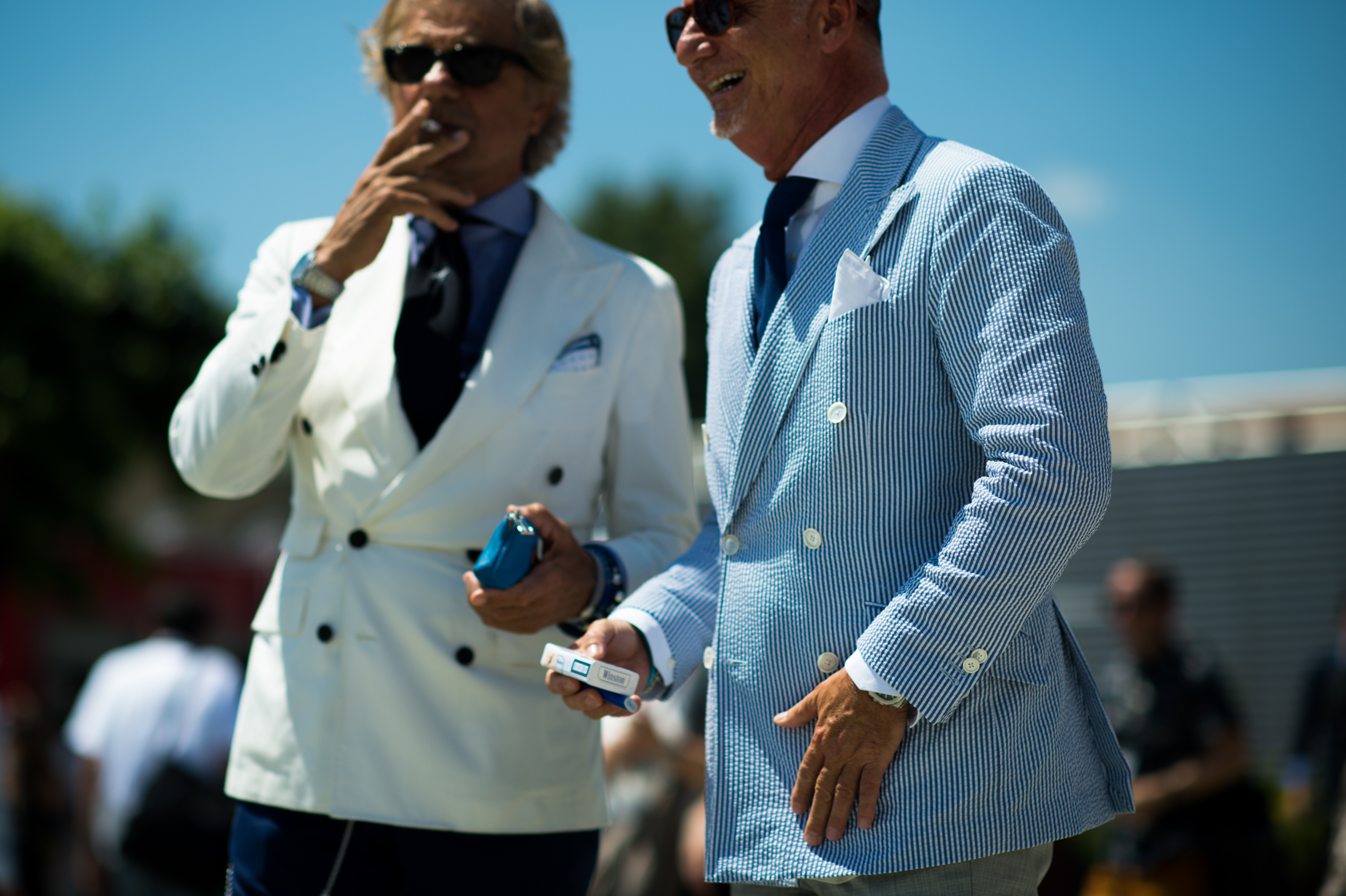 Two men wearing casual suits