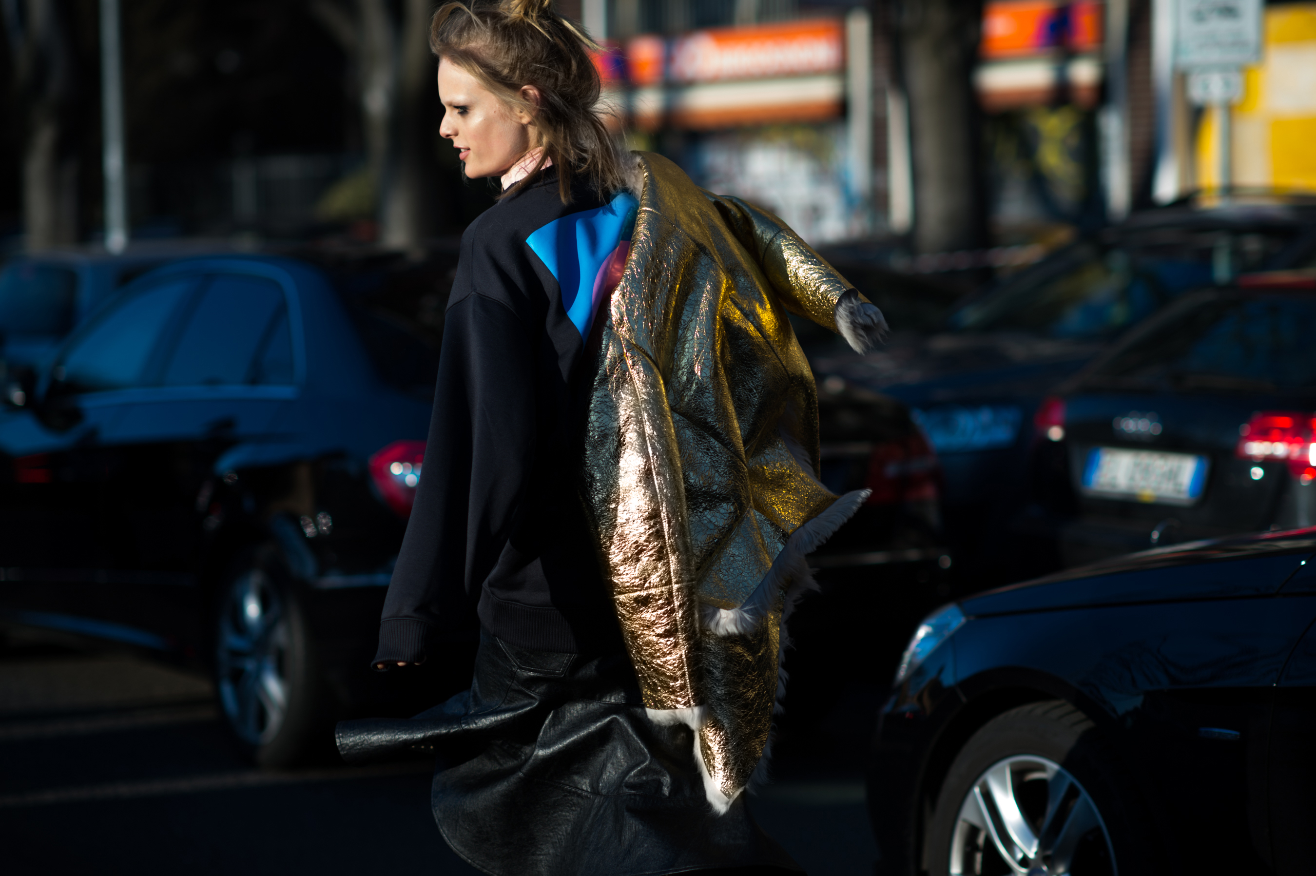 Belgian model wearing golden jacket