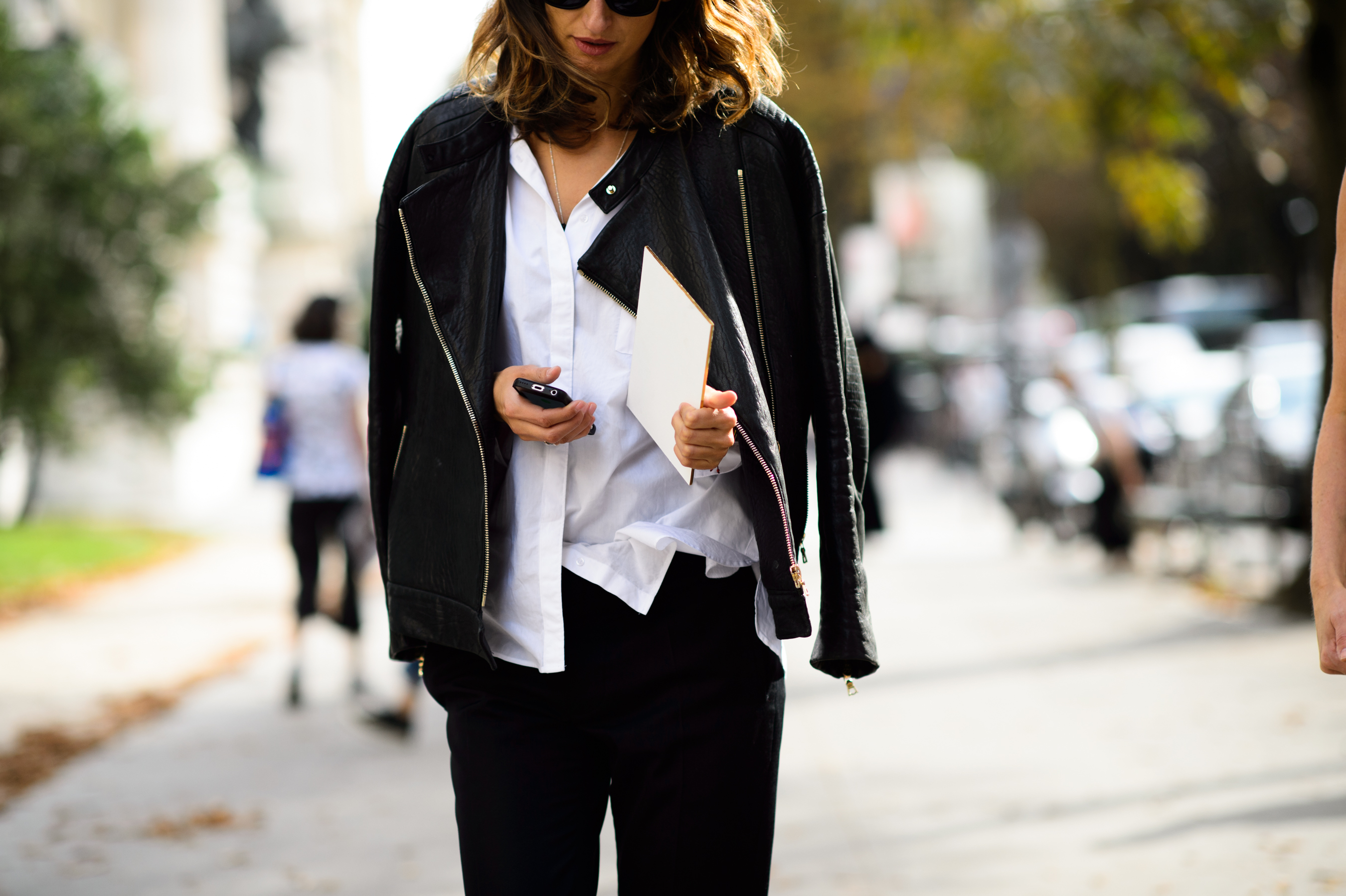 Stylist wearing black jacket and white shirt