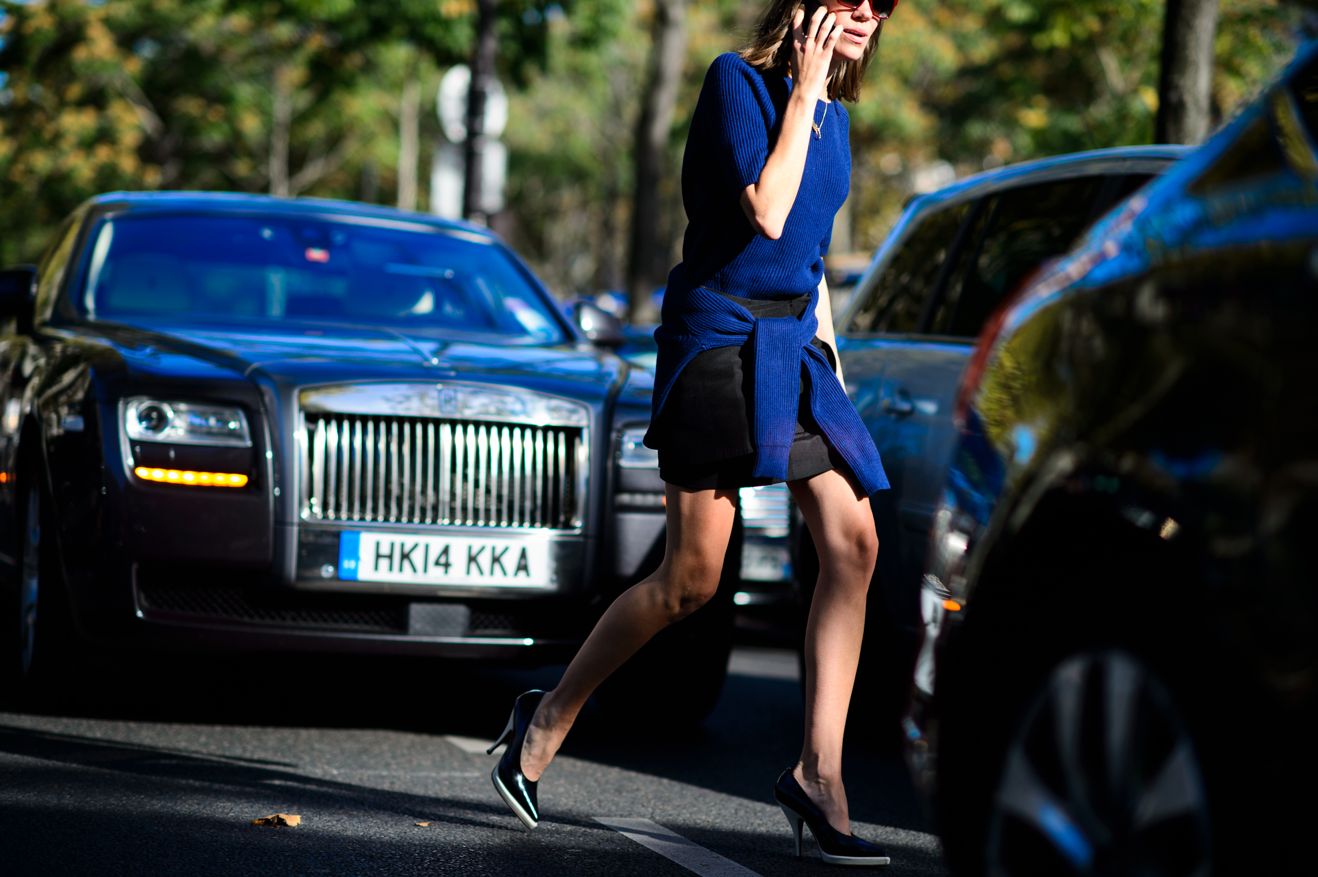 Woman wearing two blue sweaters