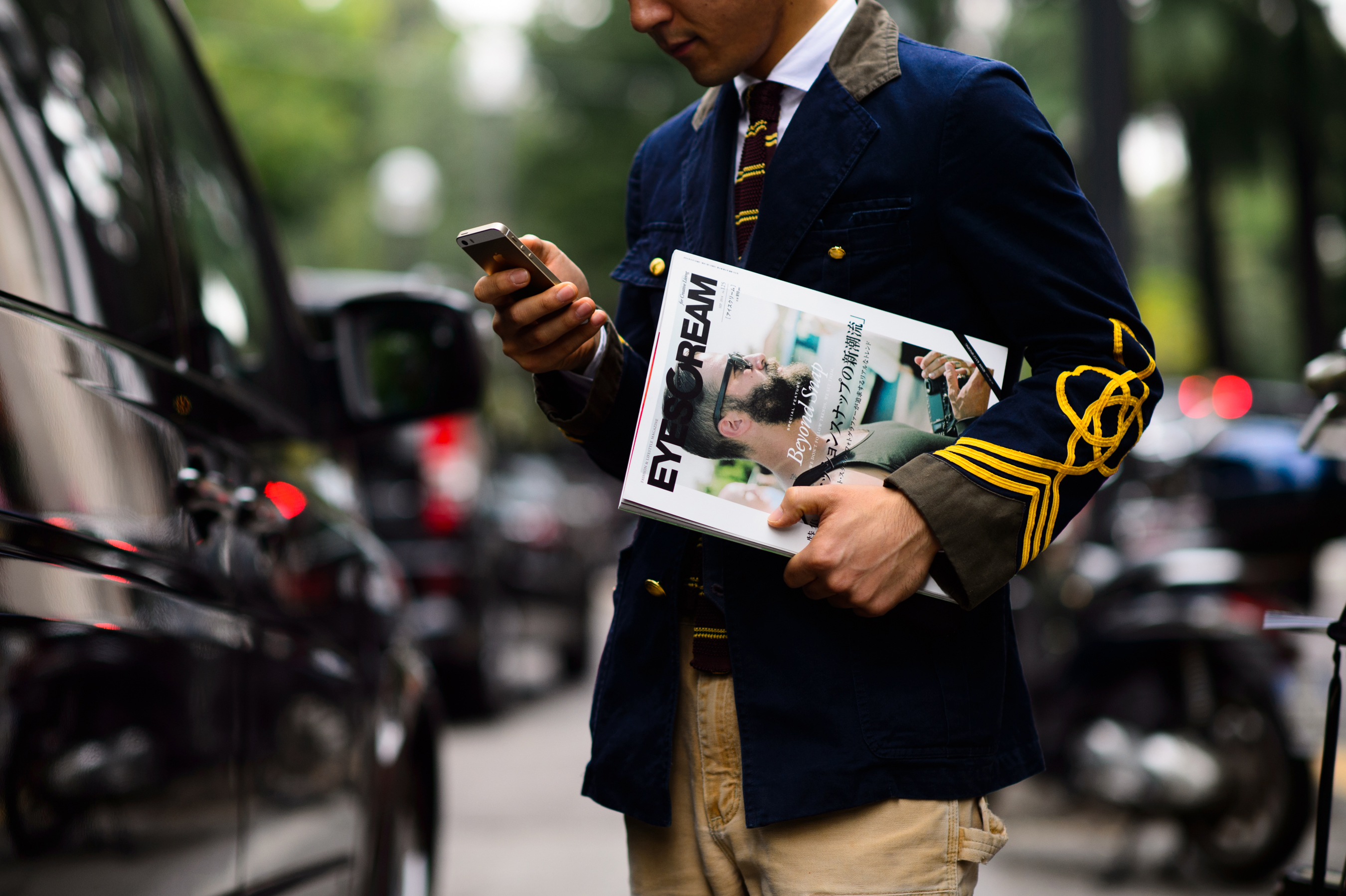 Japanese man holding magazine in his hand