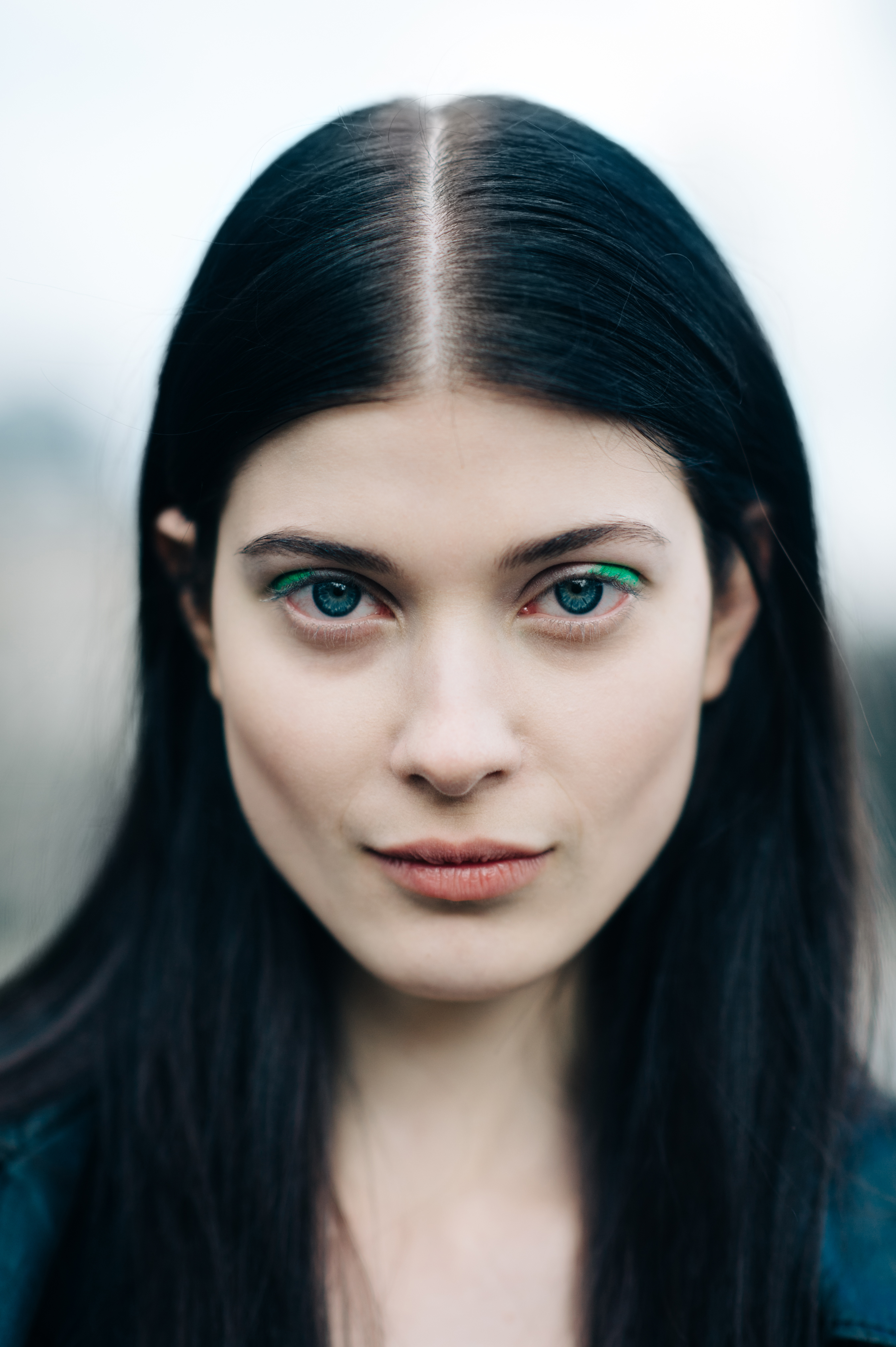 Portrait of a German model wearing green make up