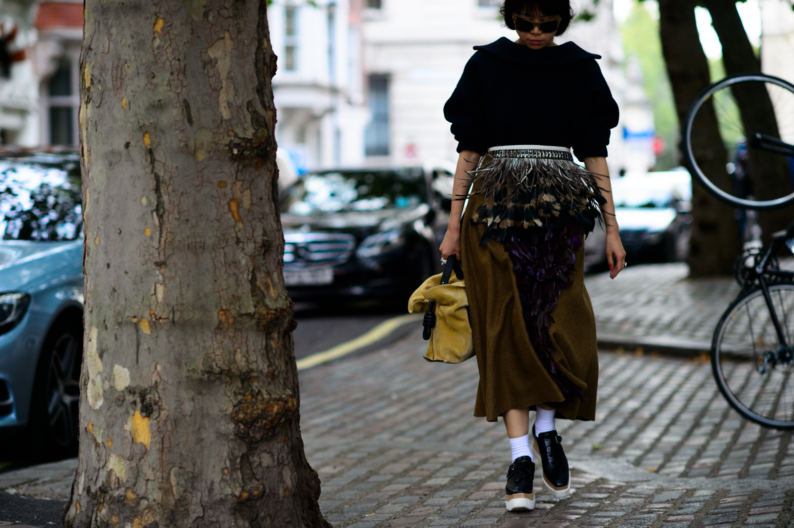 Asian blogger wearing skirt with feathers