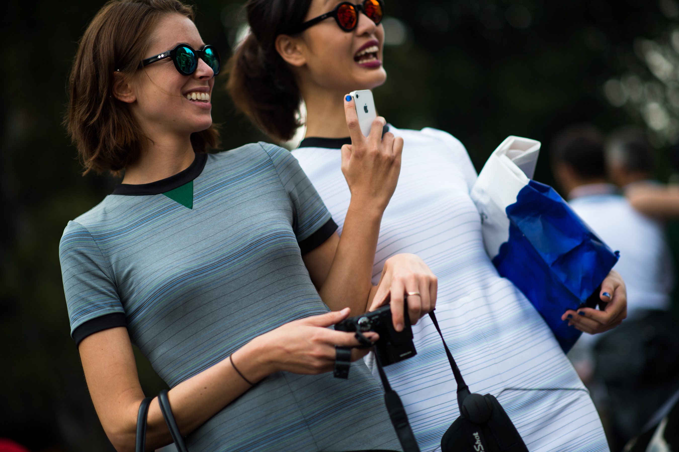 Two women wearing striped outfits