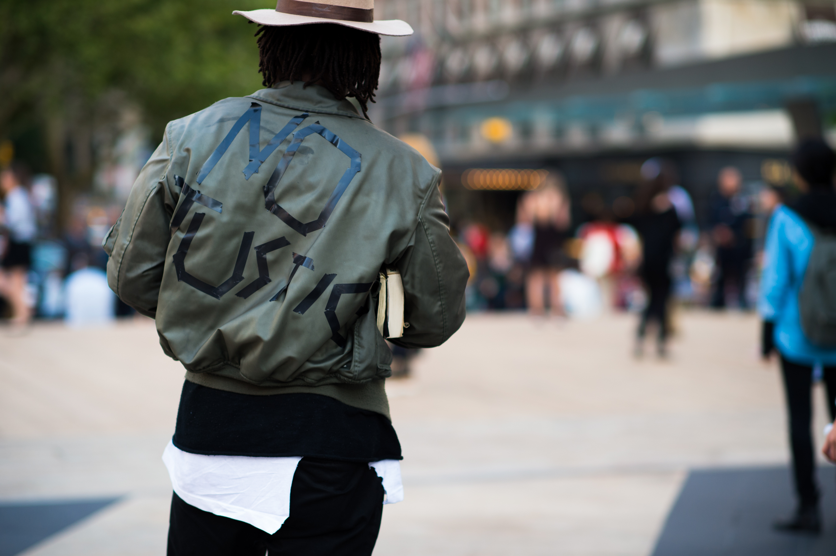 Man wearing No Justice bomber