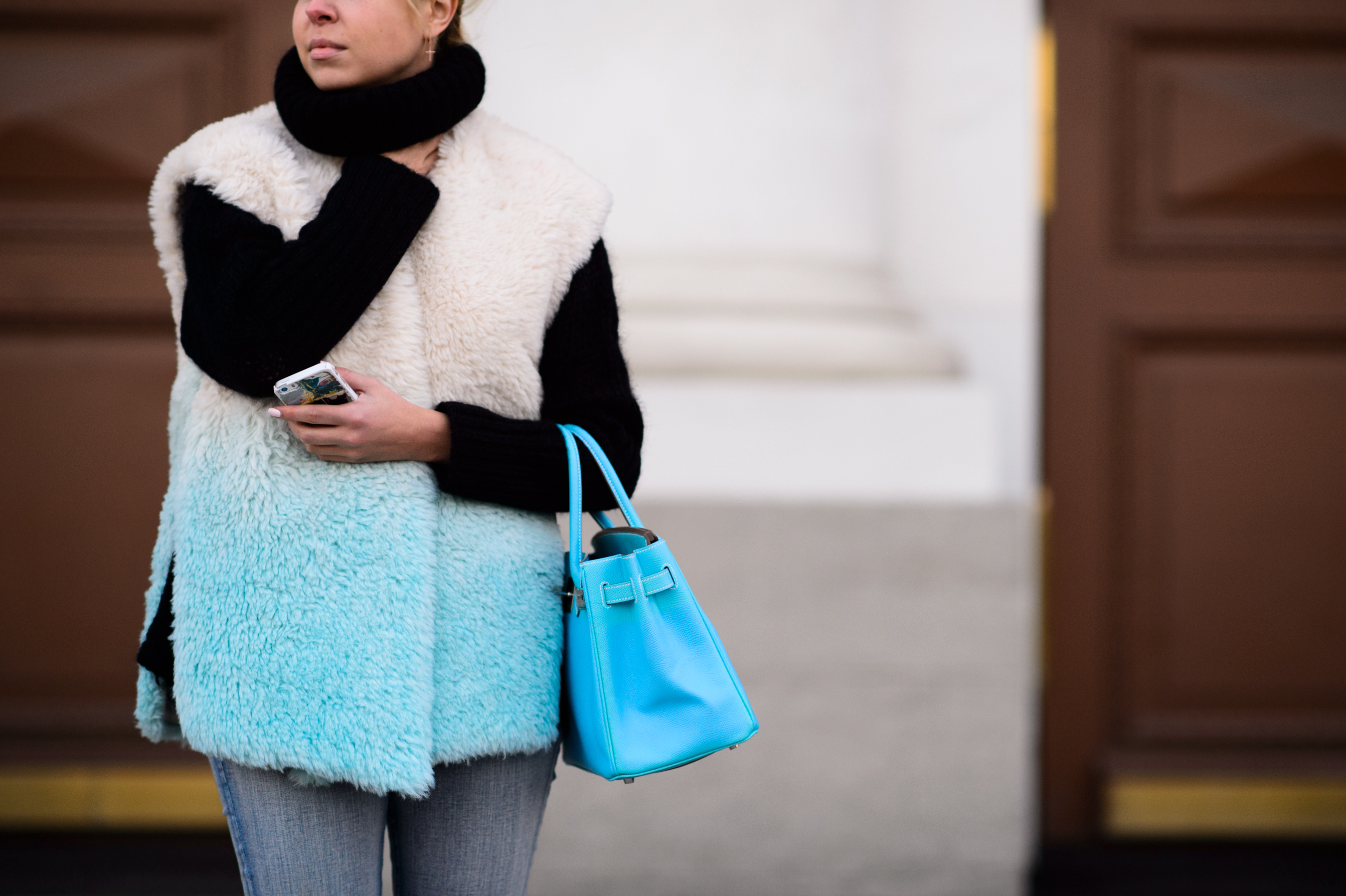 Woman wearing furry vest