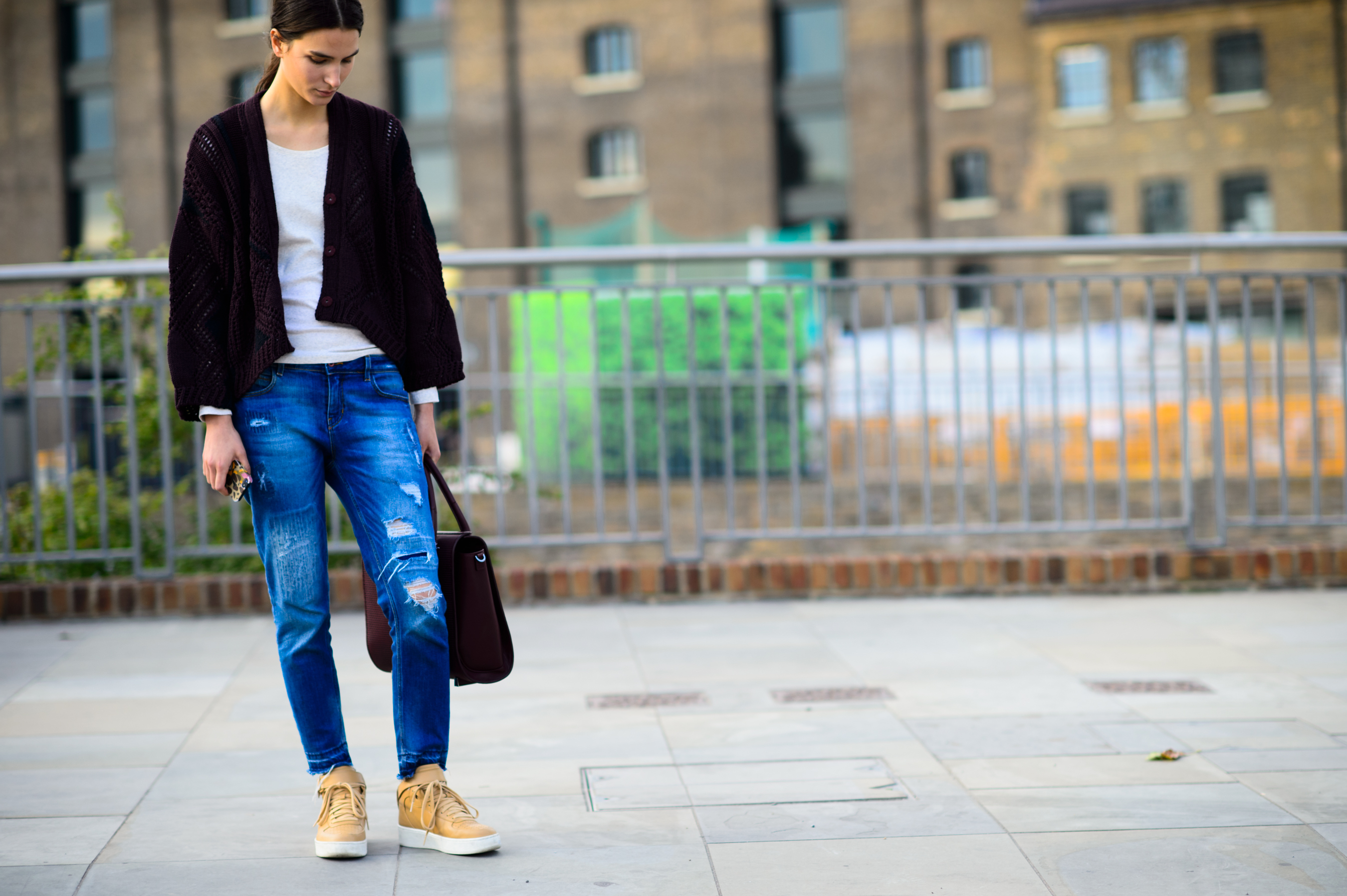 Model wearing beige sneakers after the show