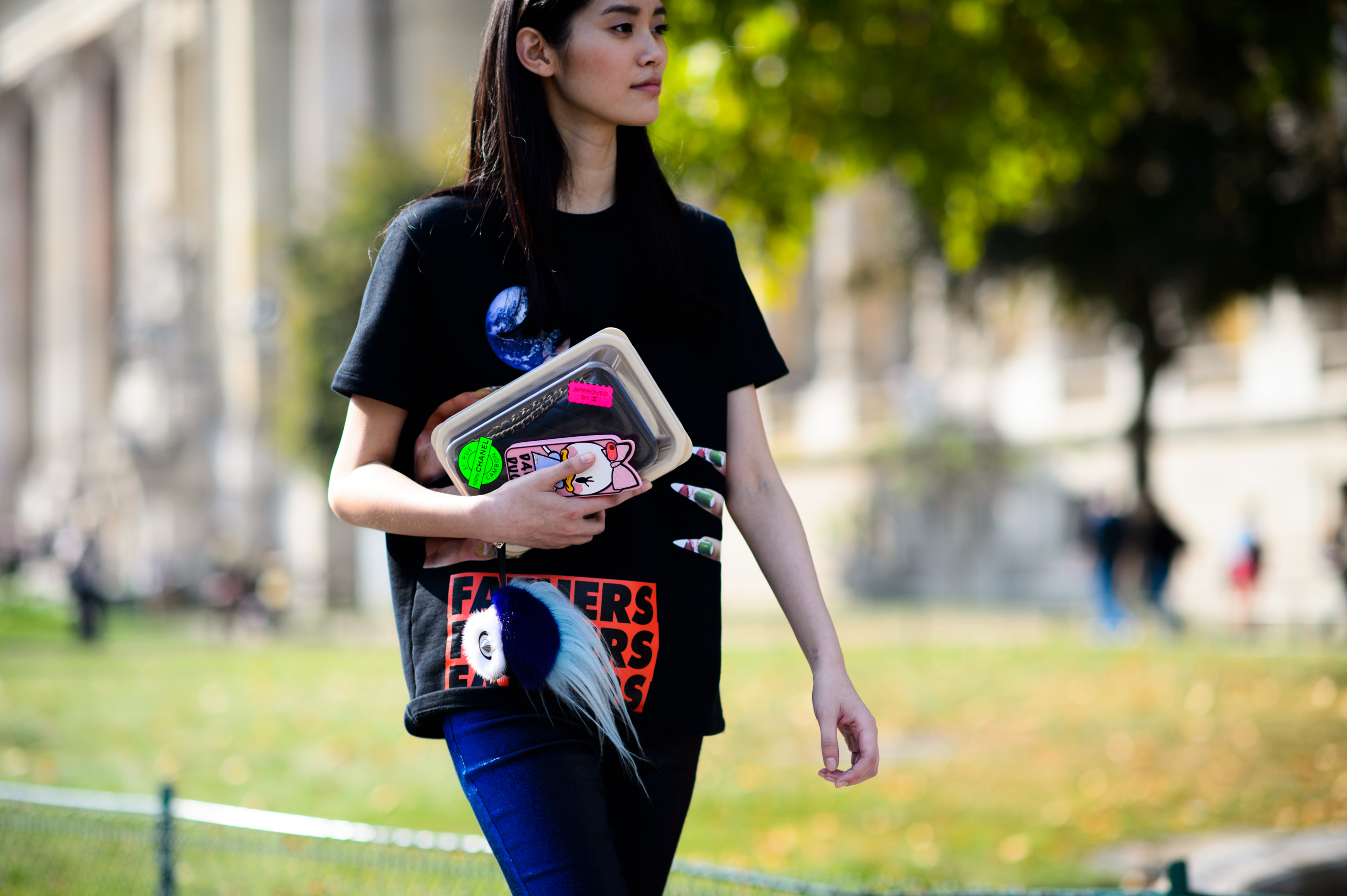 Model holding Chanel packed clutch after the show