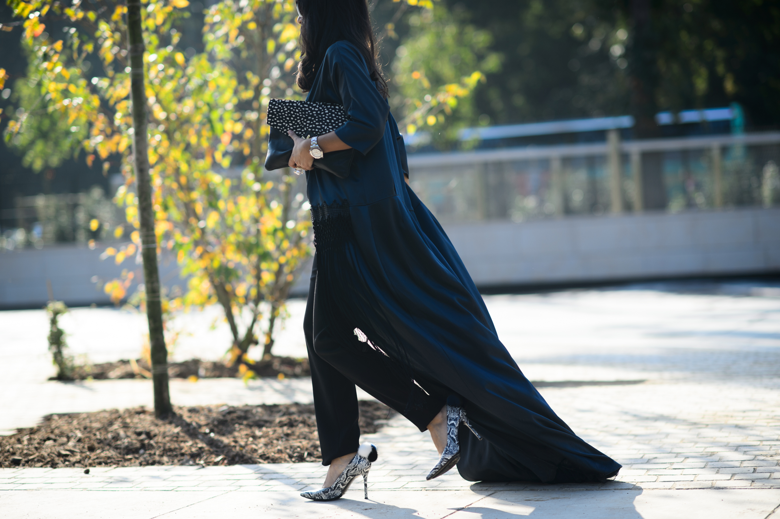 Arabic woman wearing long green summer coat