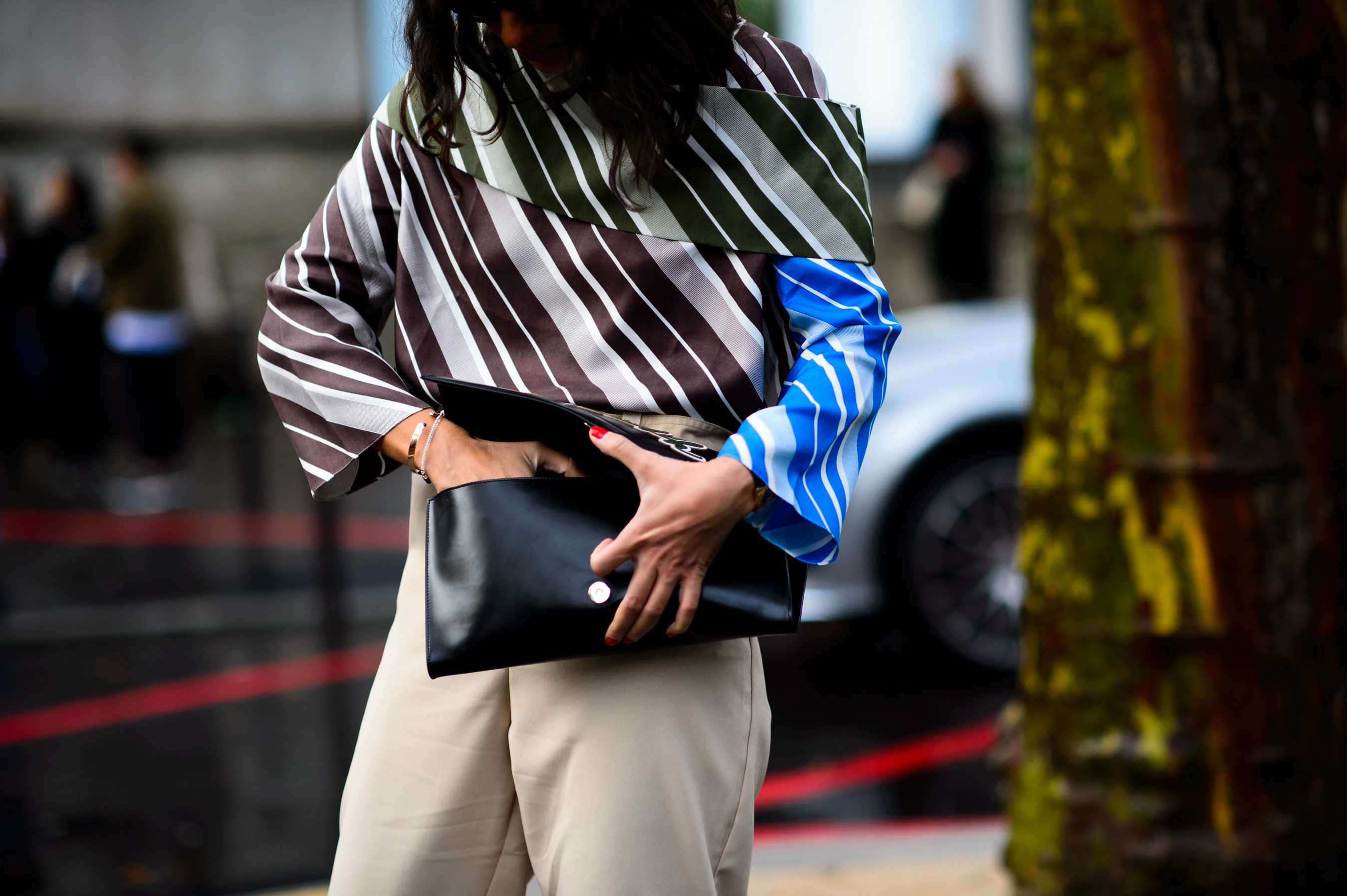Woman wearing diagonal striped J.W.Anderson shirt