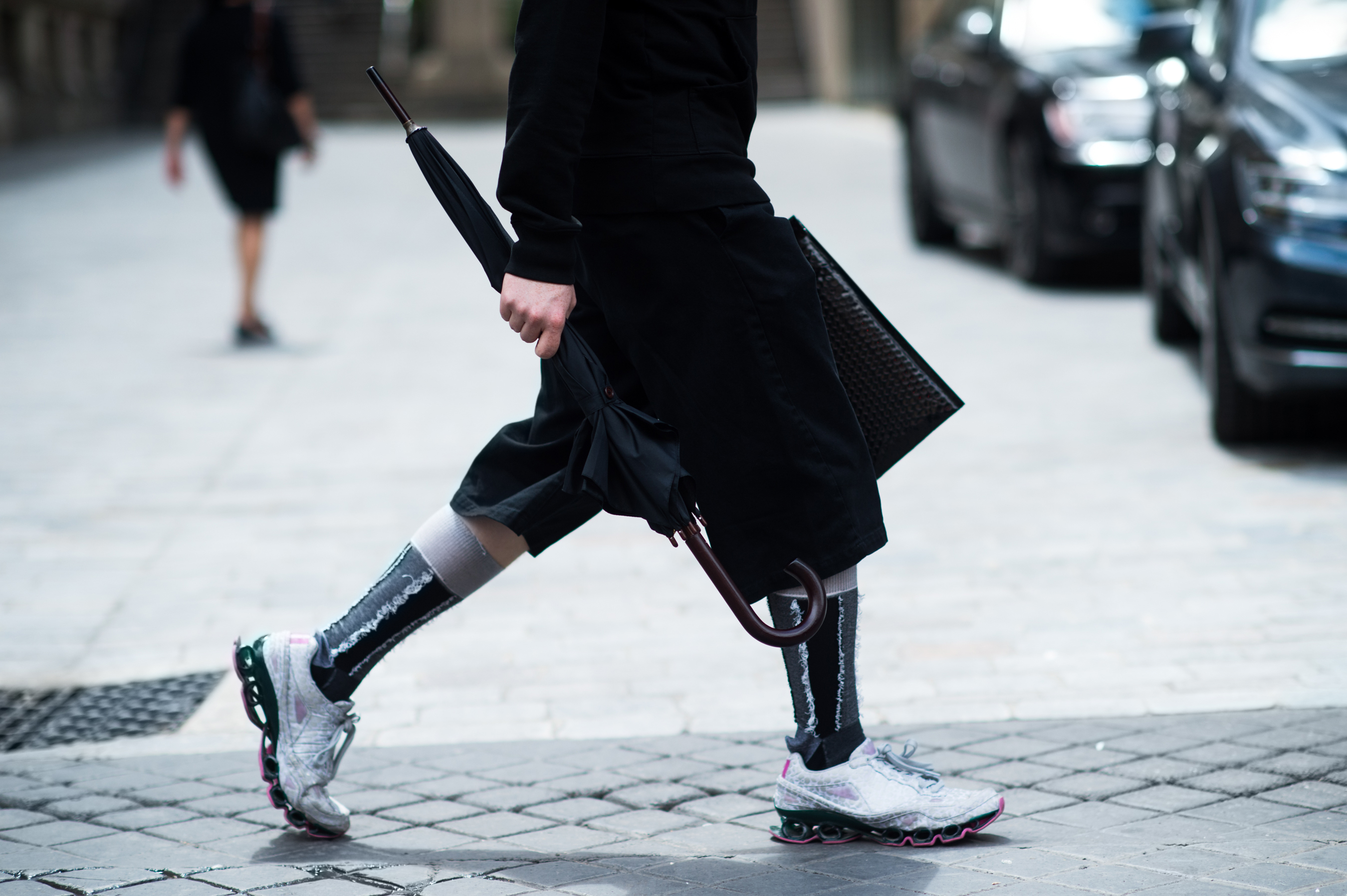 Man wearing tall socks and sneakers