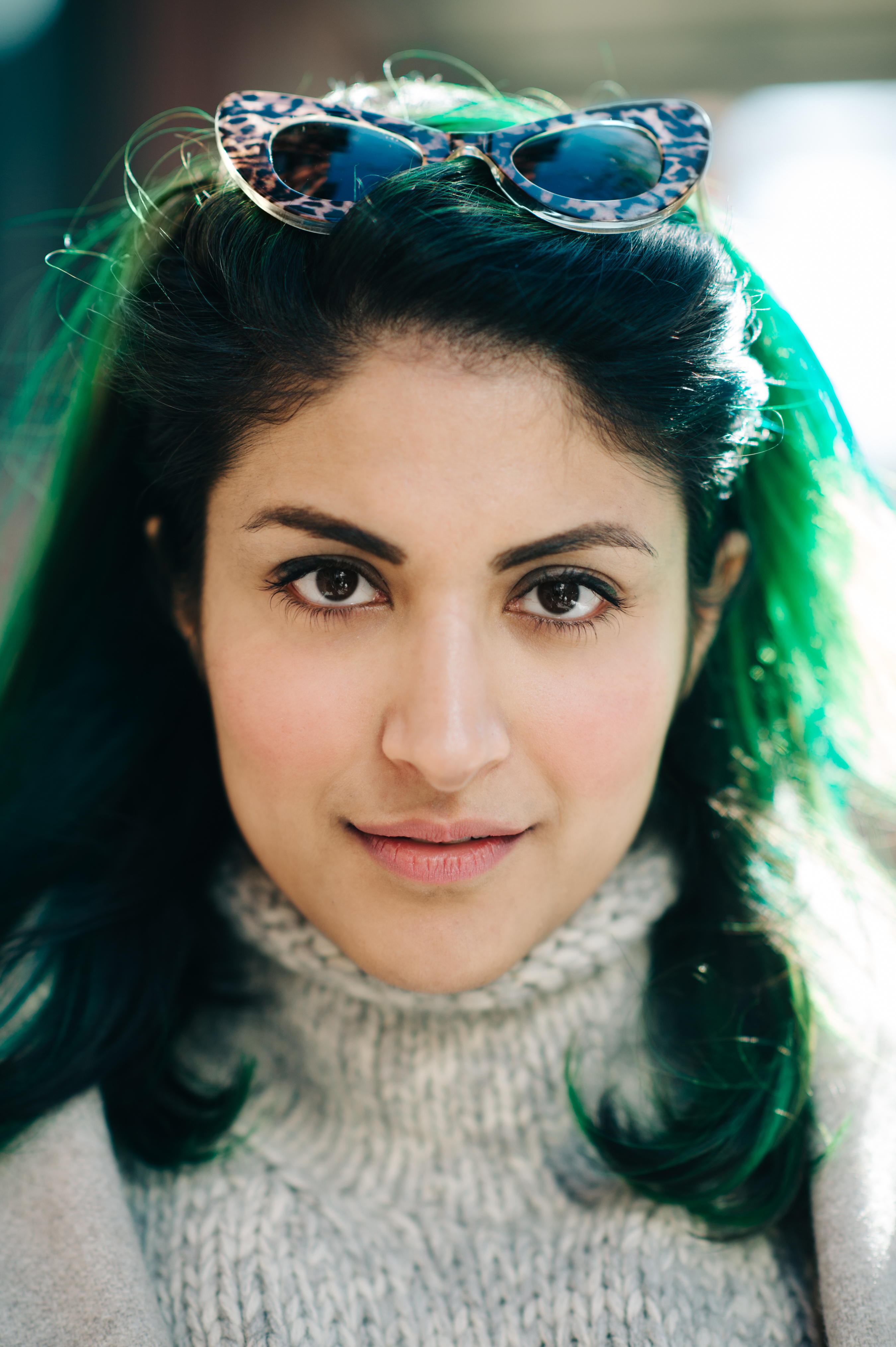 Portrait of a magazine editor with green hair