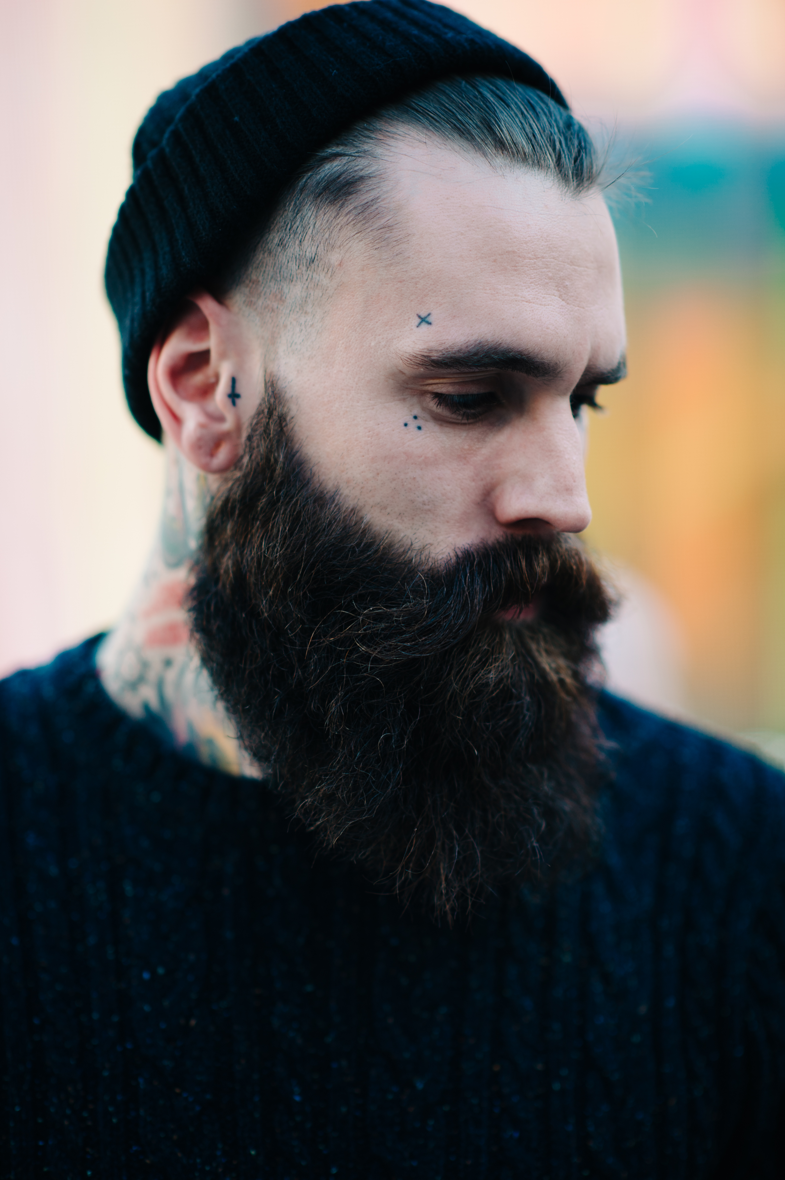 Portrait of a man with beard and tattoos