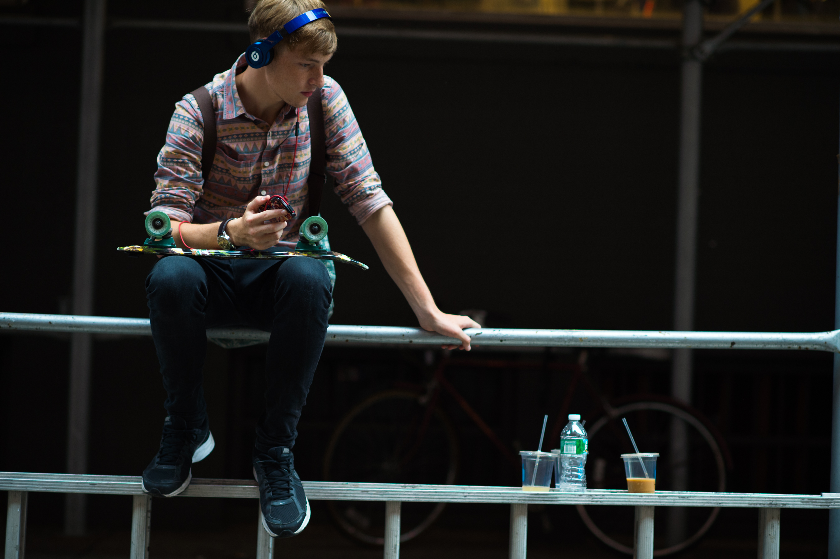 Male model wearing Beats by Dre with skateboard