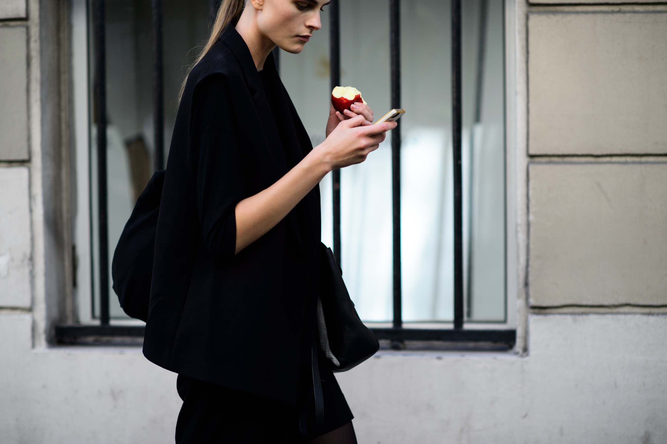 Model eating an apple after the show