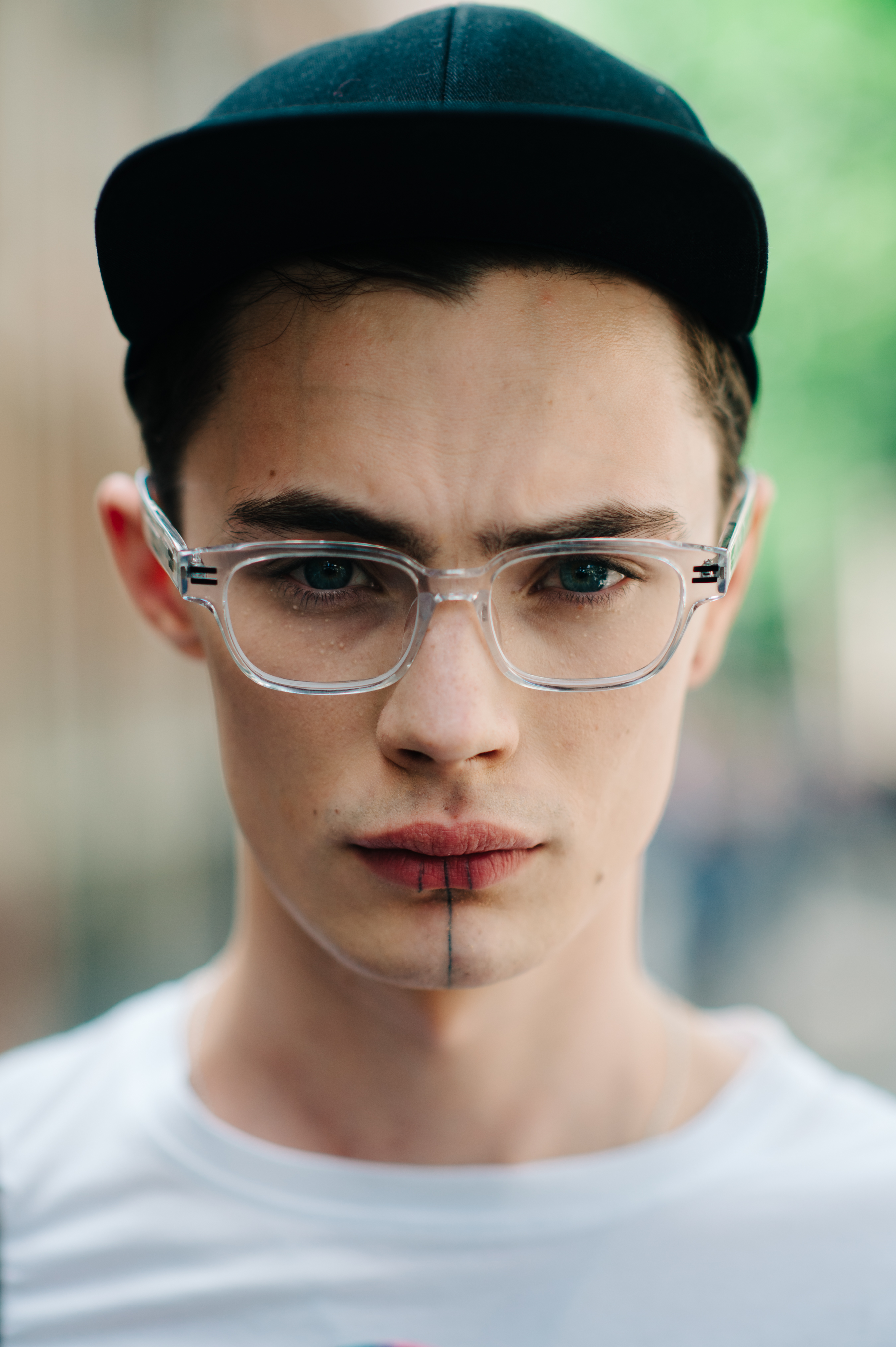 Portrait of a male model with tattooed lips