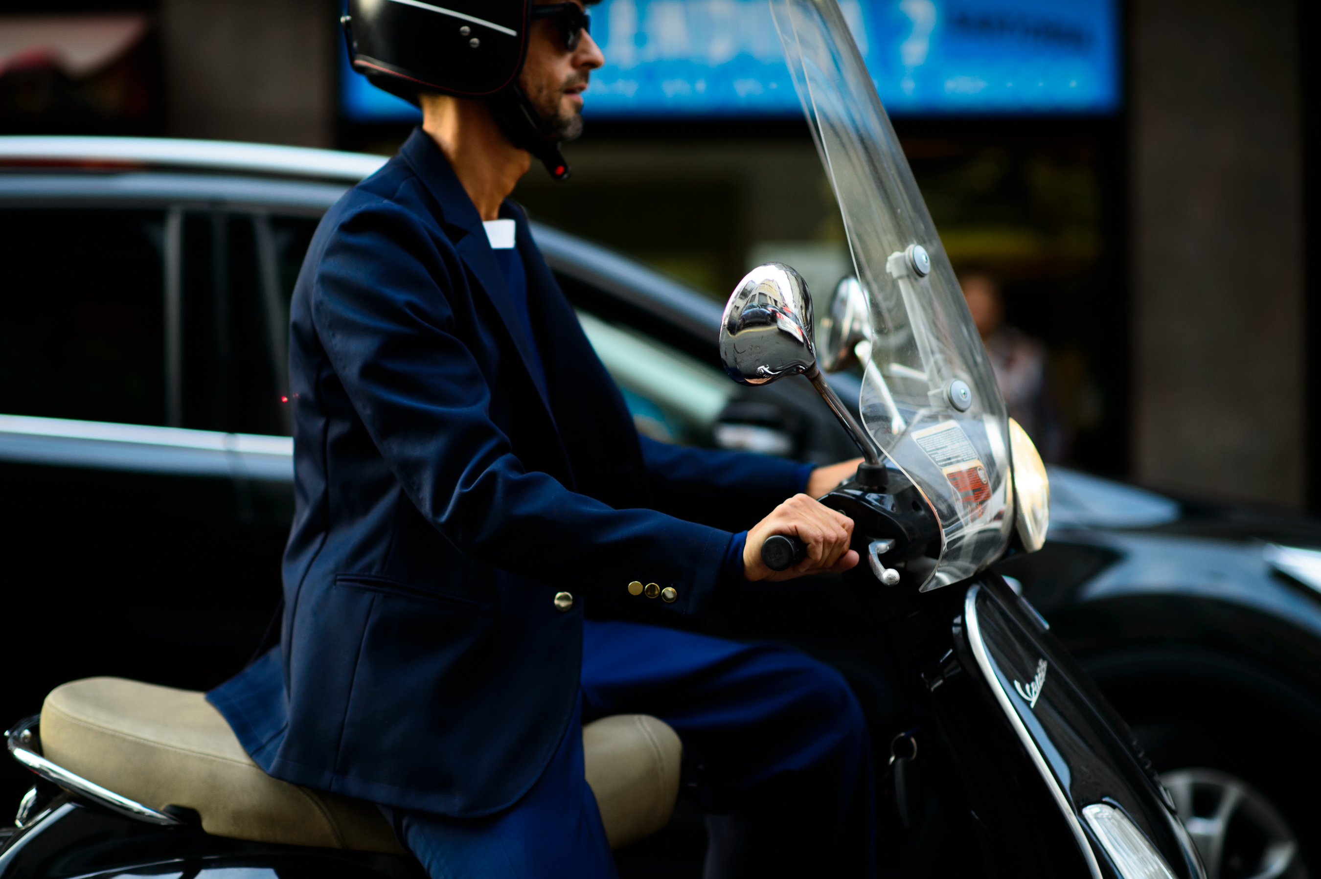 Italian fashion journalist riding a scooter