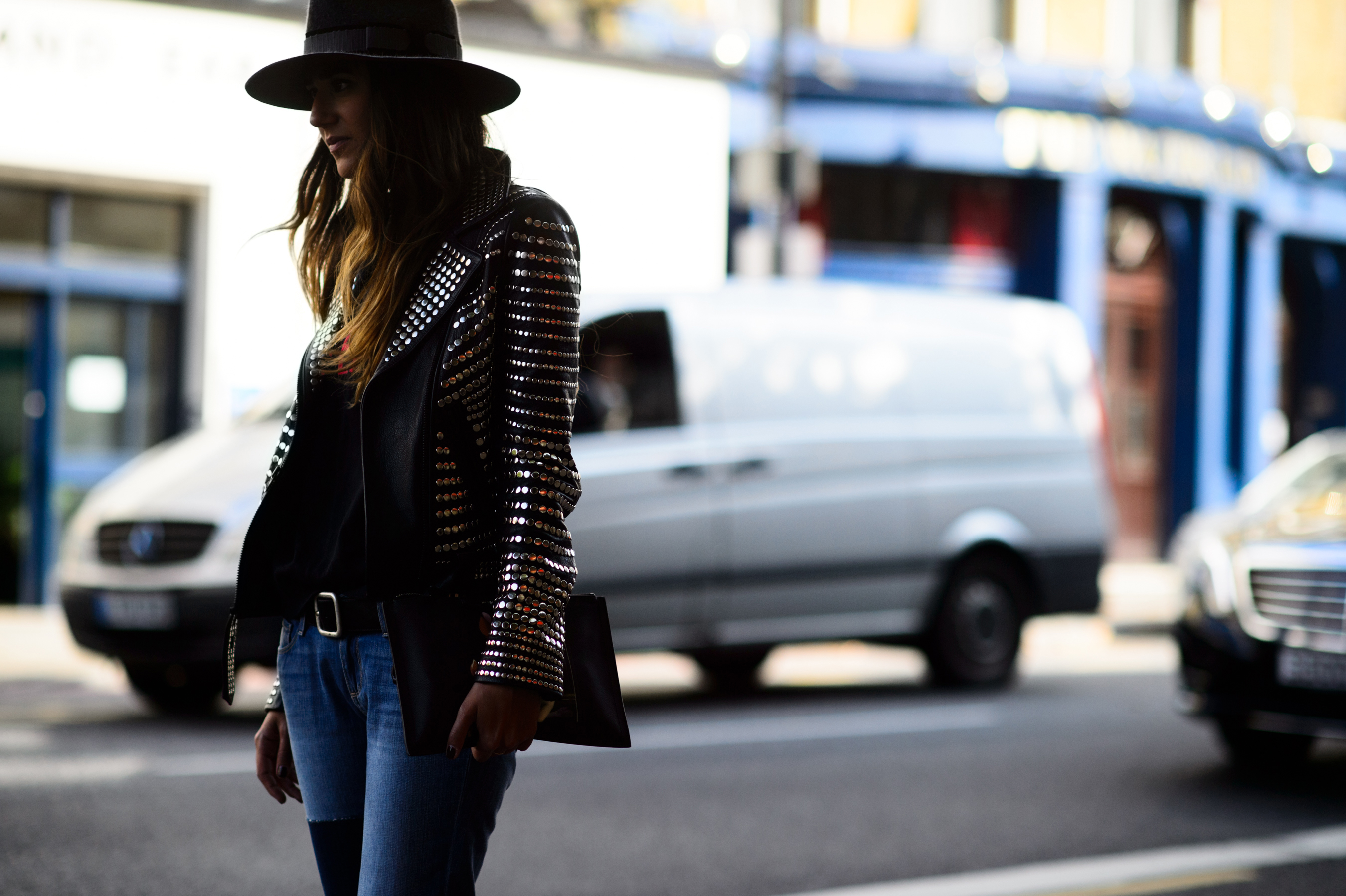 Woman wearing leather jacket with silver details