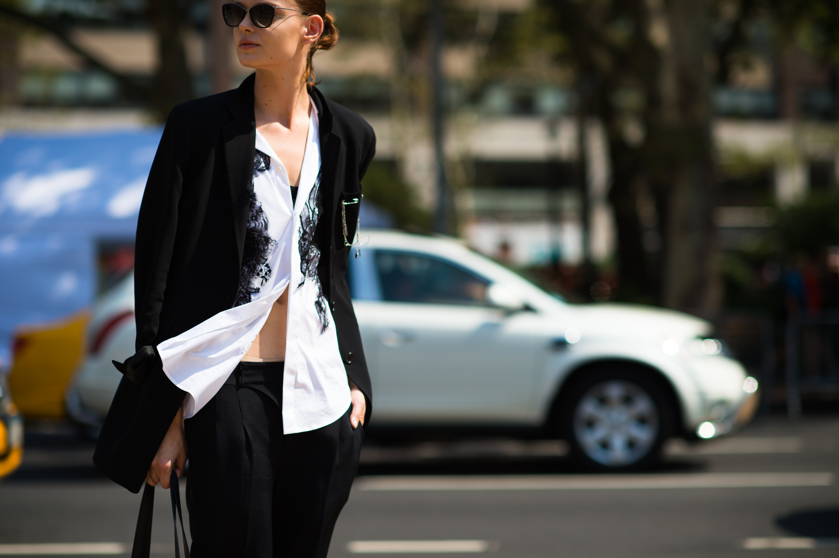 Woman wearing white shirt with bare stomach