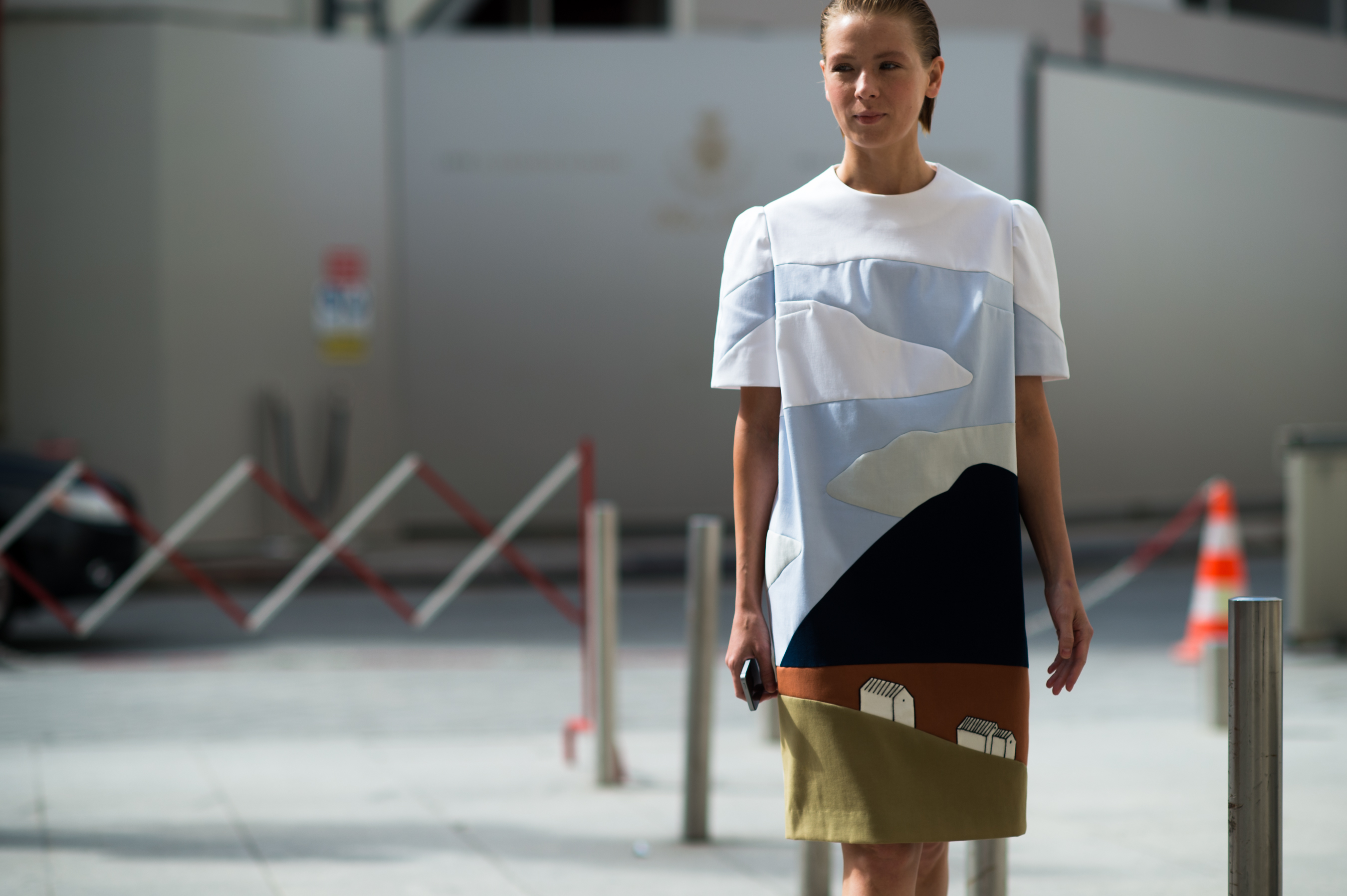 Russian designer wearing dress with graphics