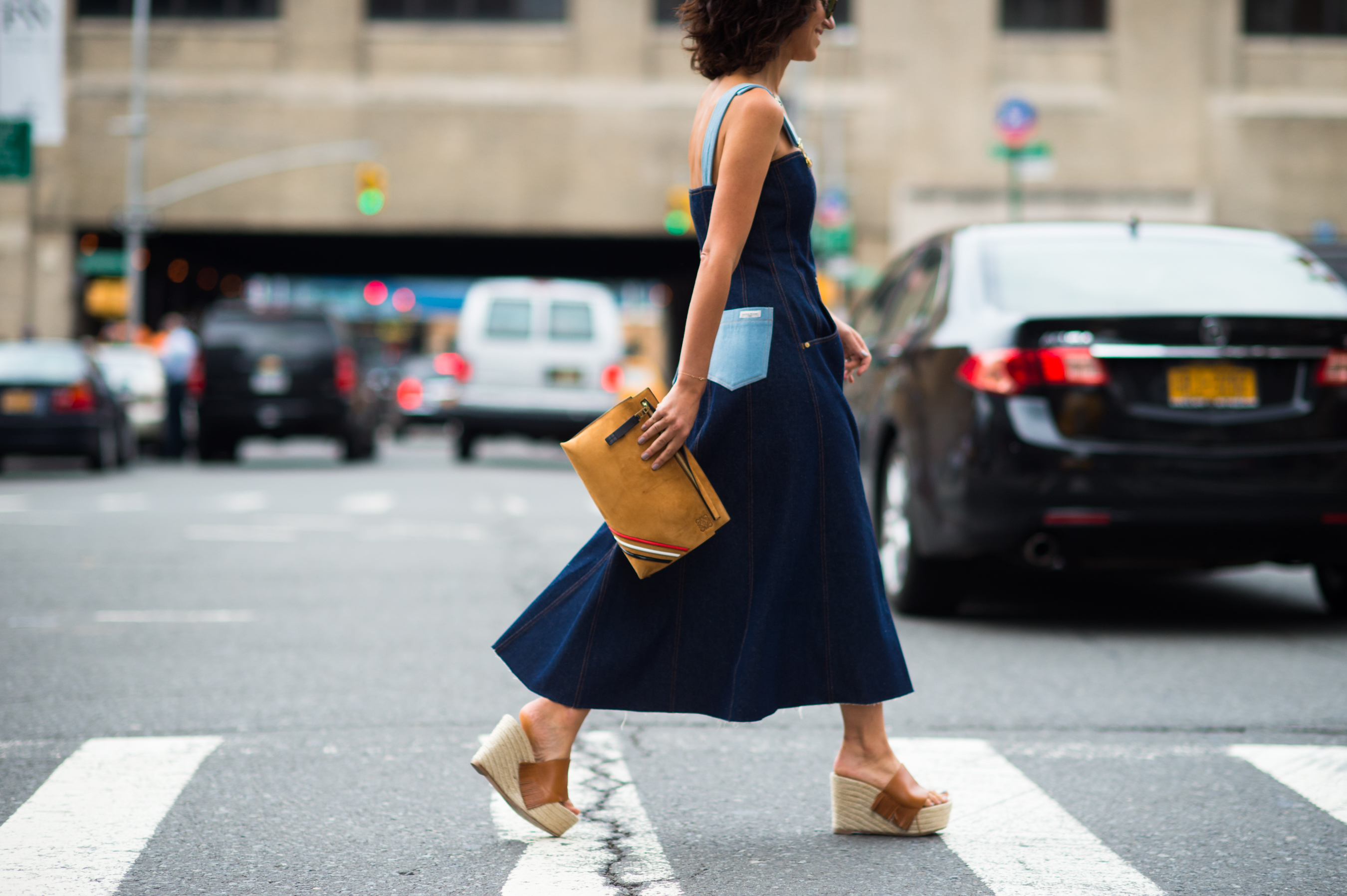 Woman wearing denim dress and wedges