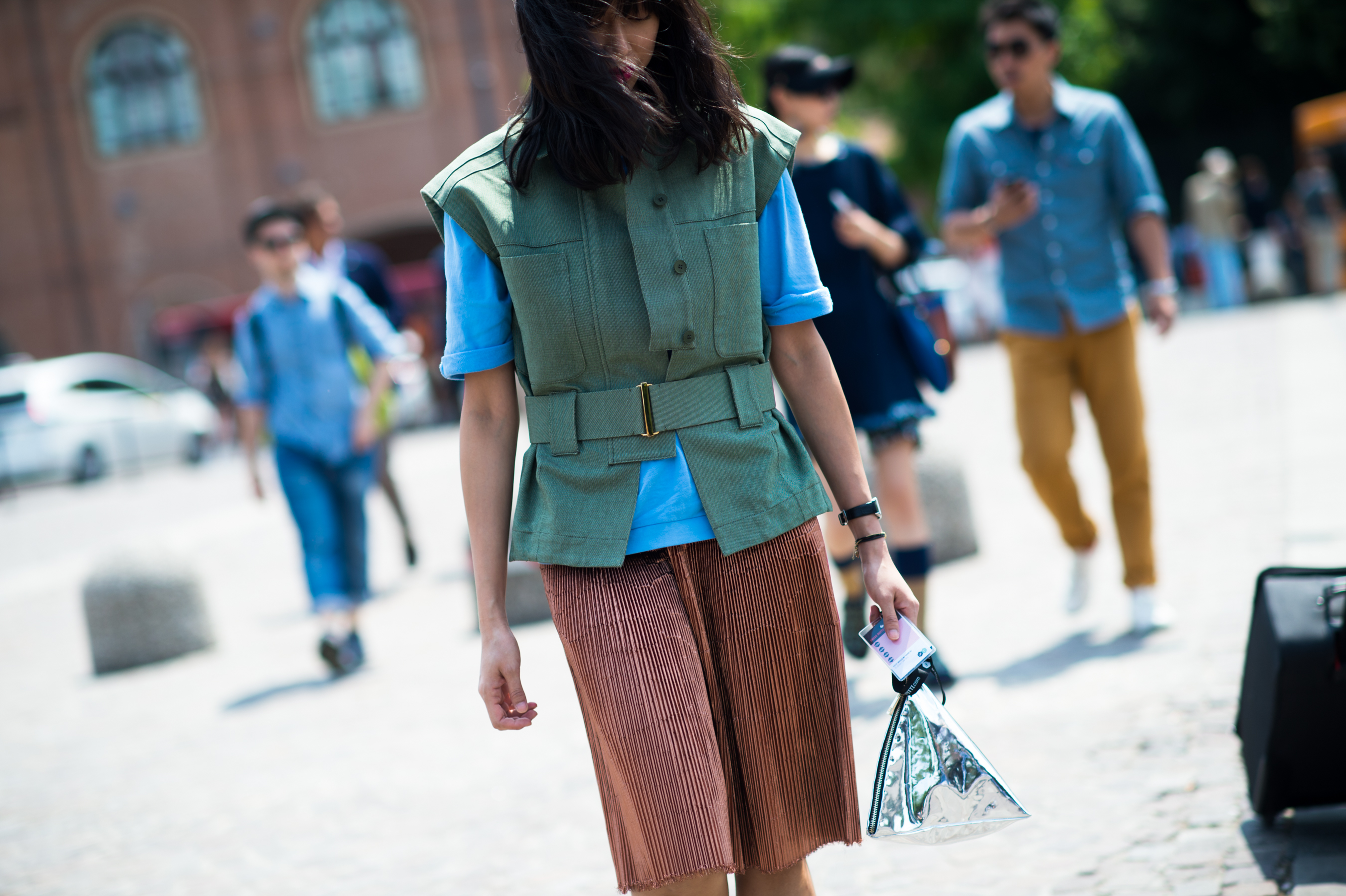 Asian woman wearing green linen vest