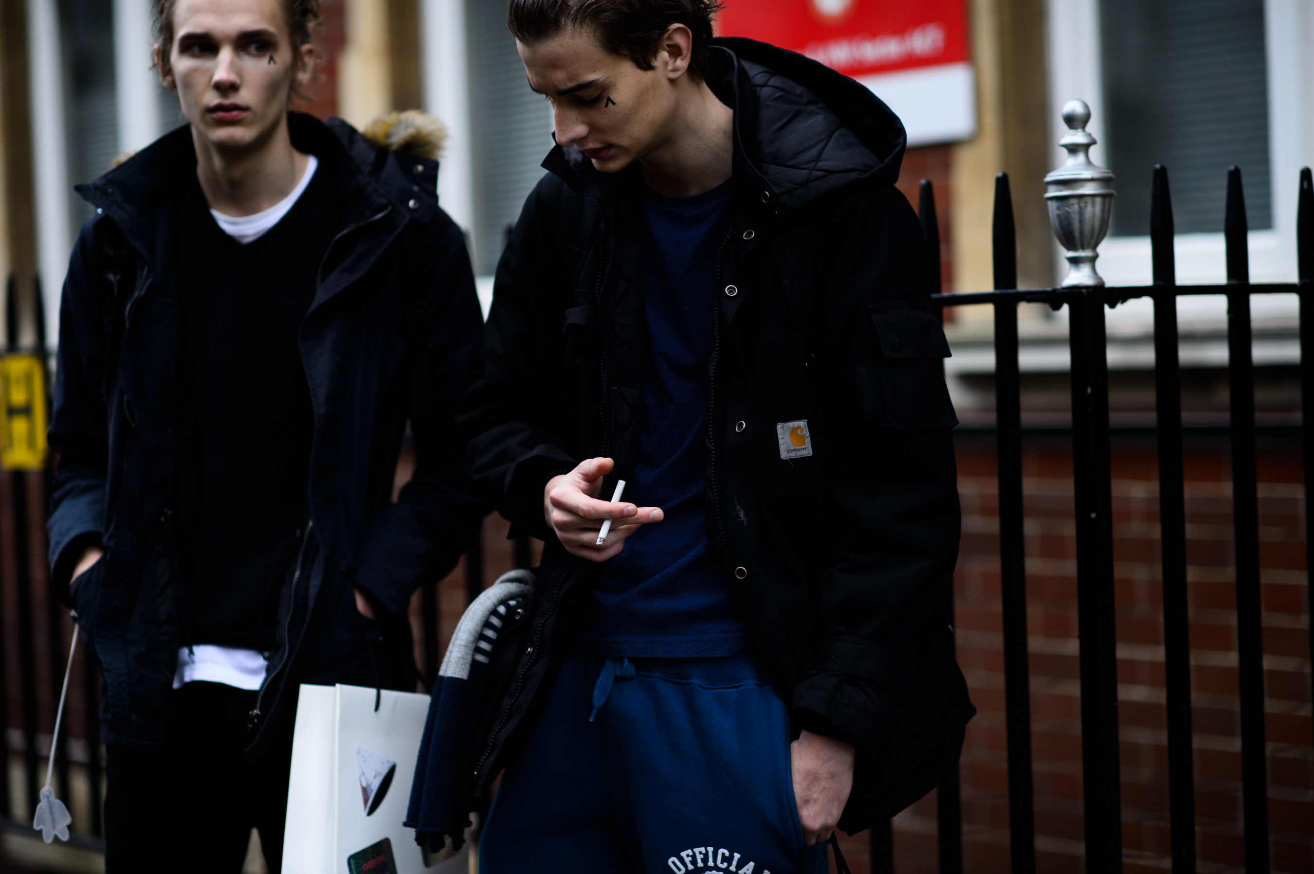 Two male models after the show