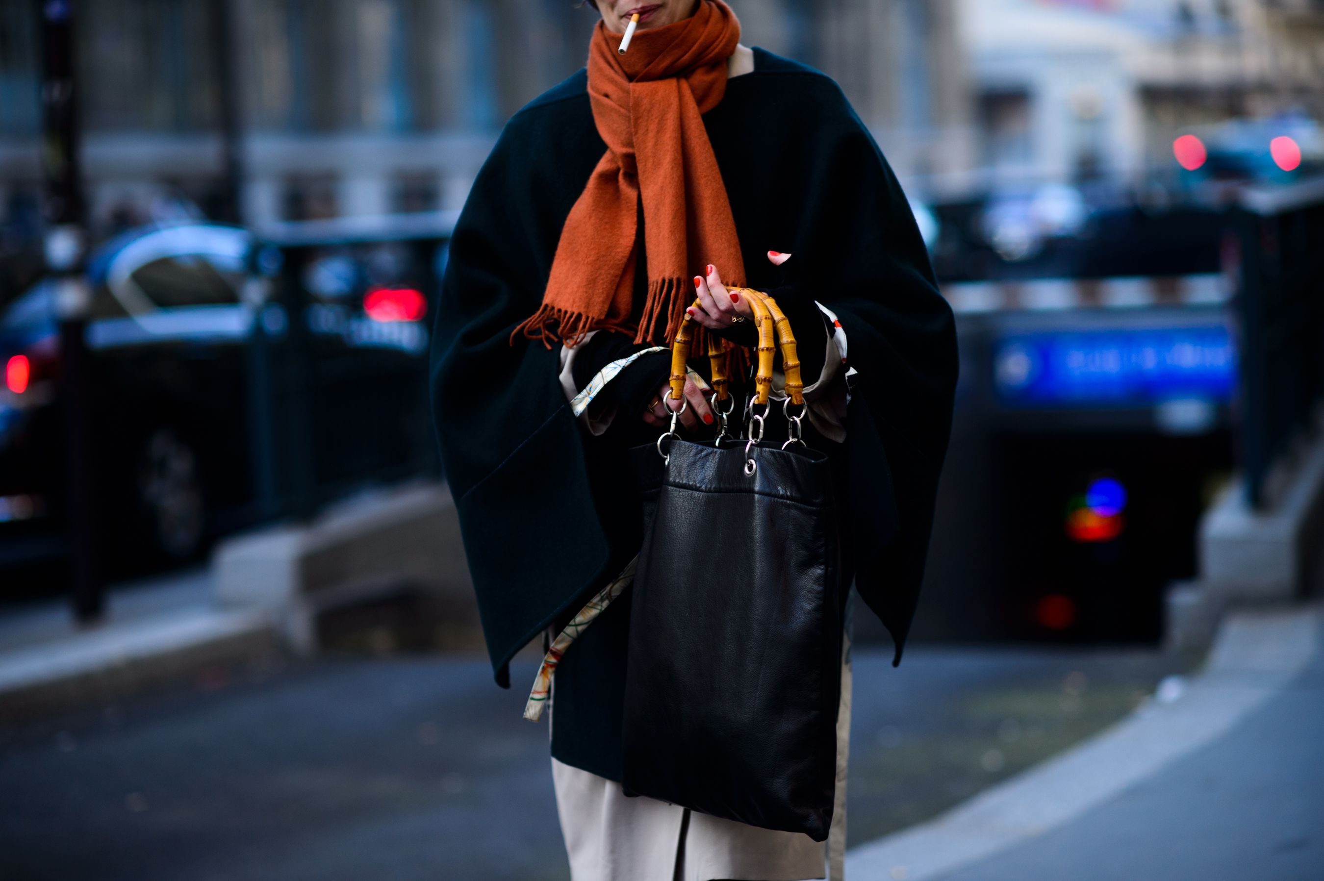 Woman holding bag bamboo handles