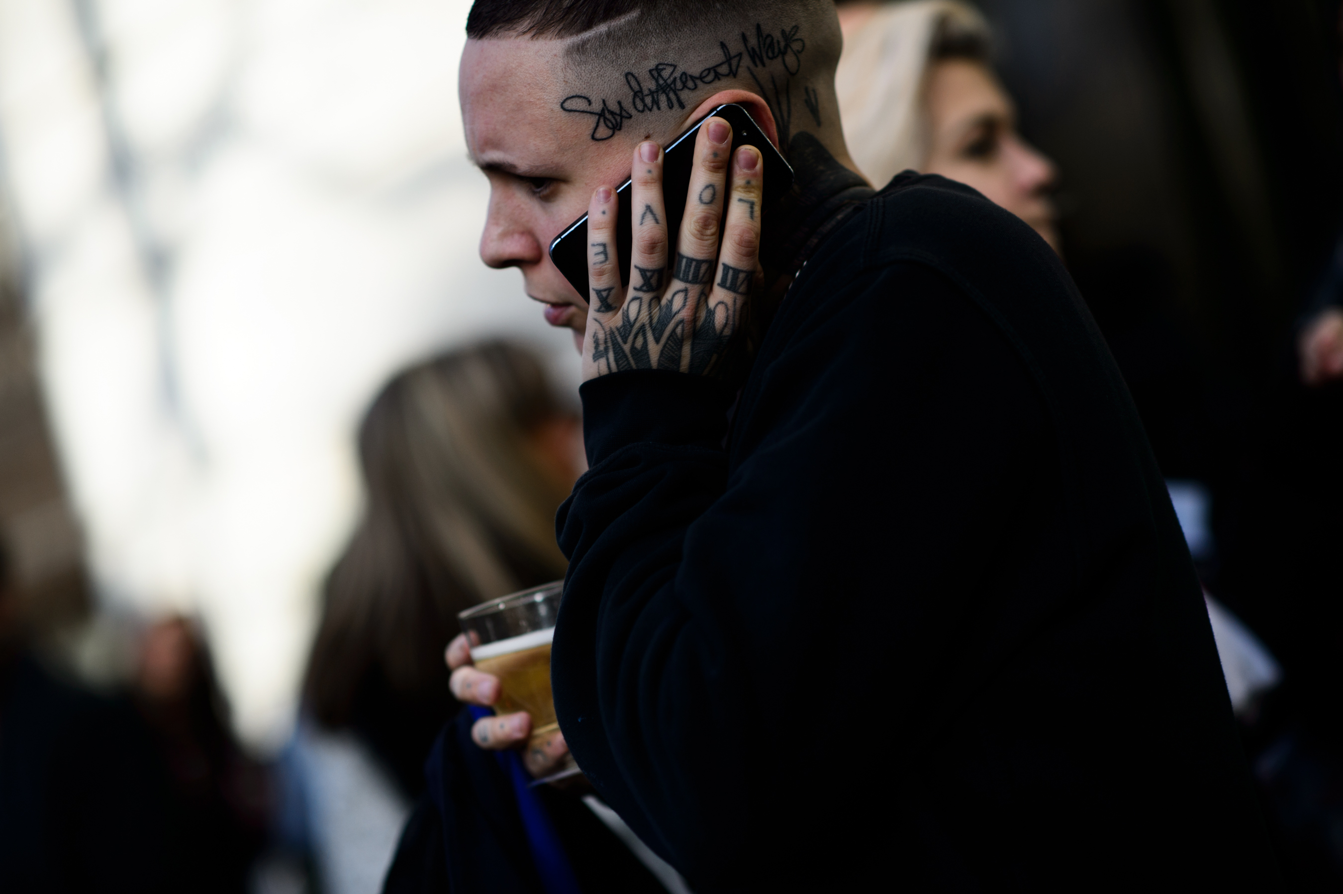 Man with tattooed hand and head