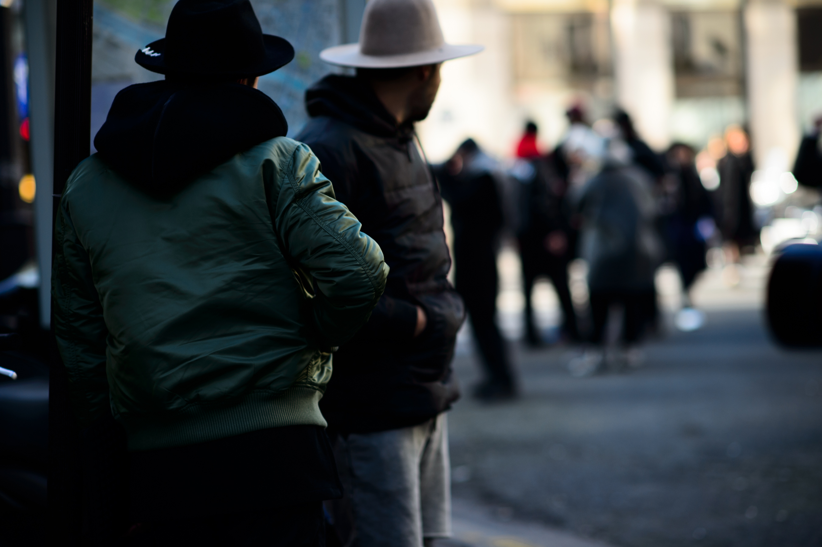 Two men wearing hats