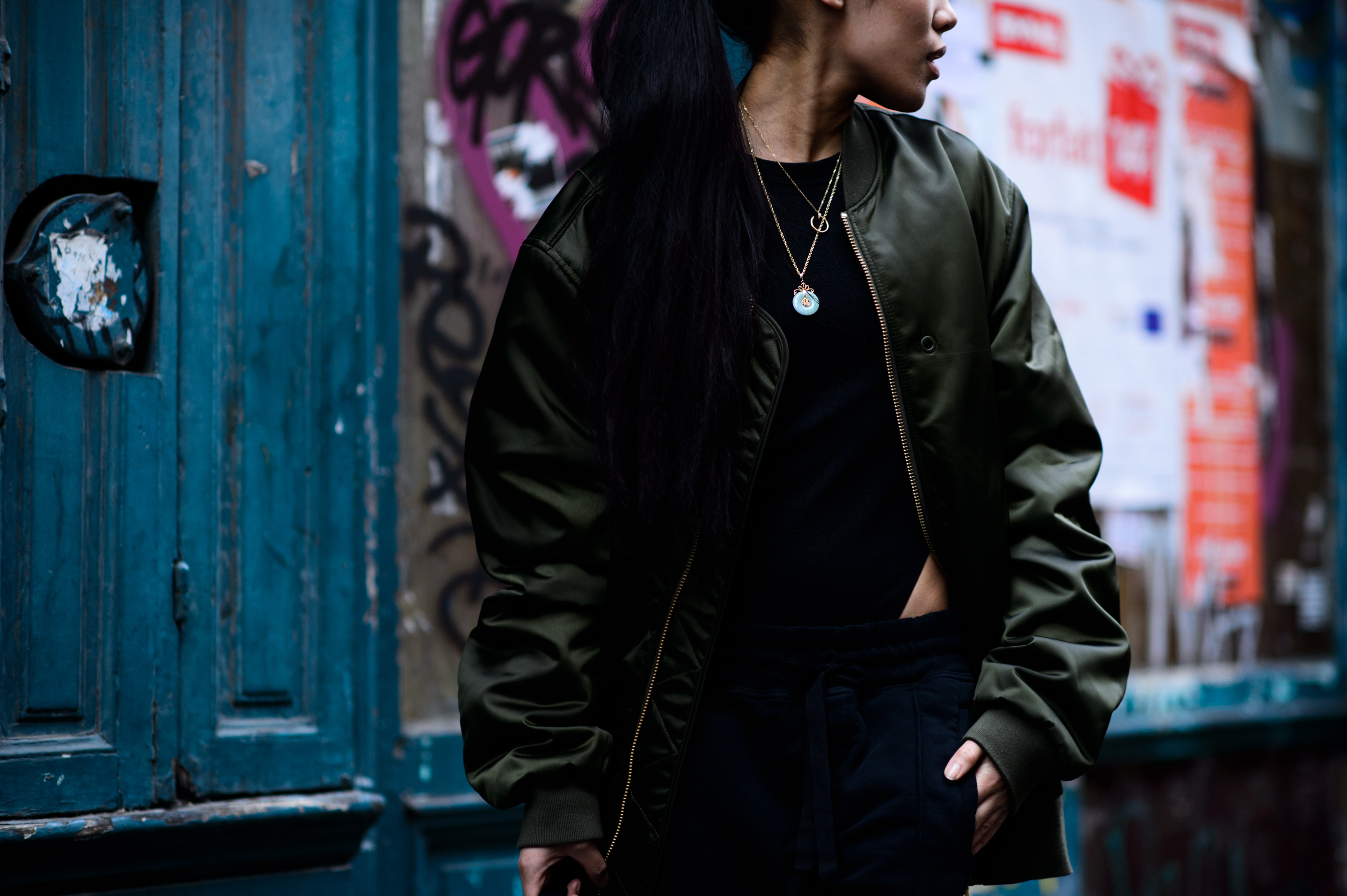 Woman wearing green bomber