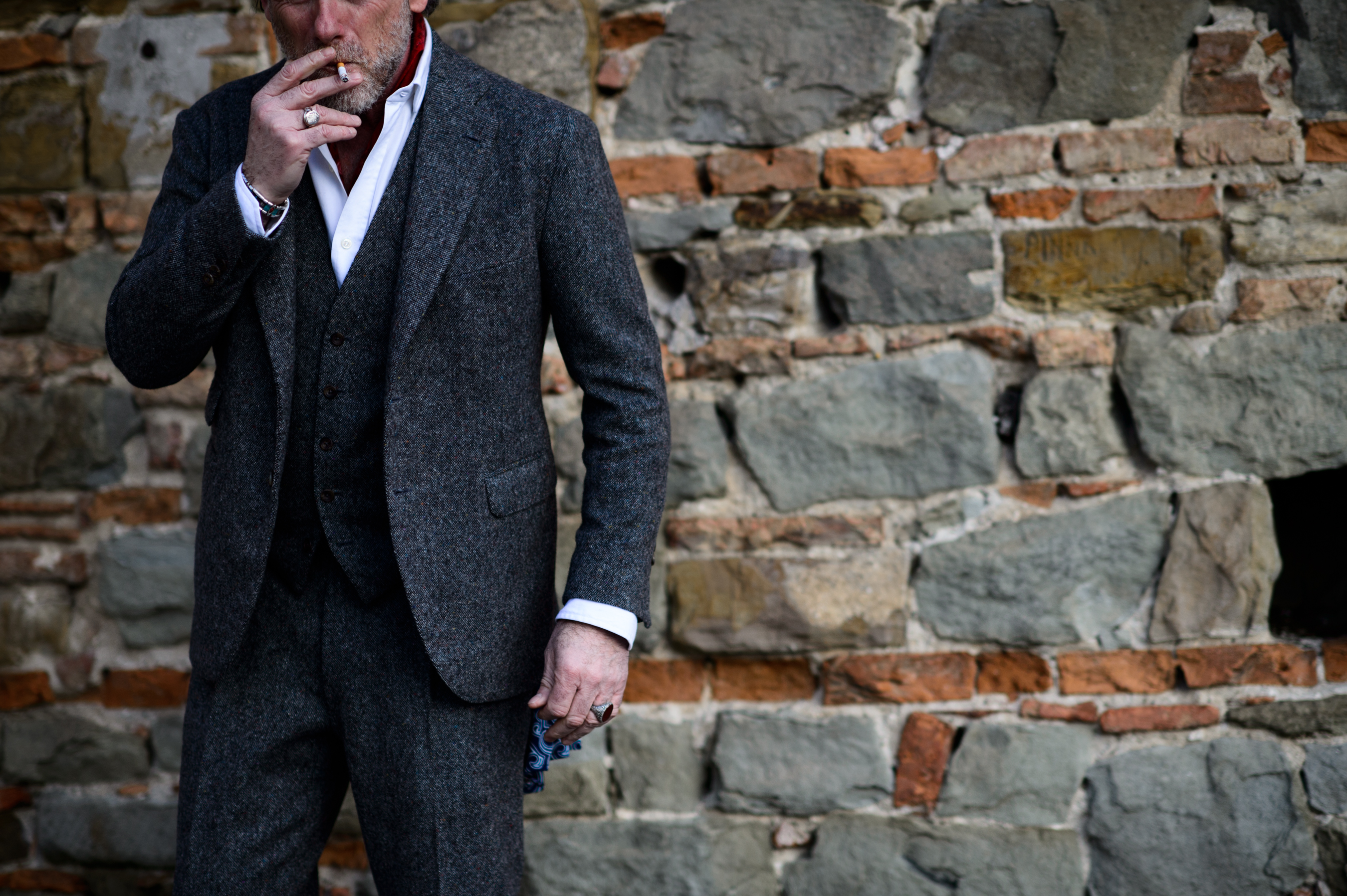 Italian man wearing grey suit