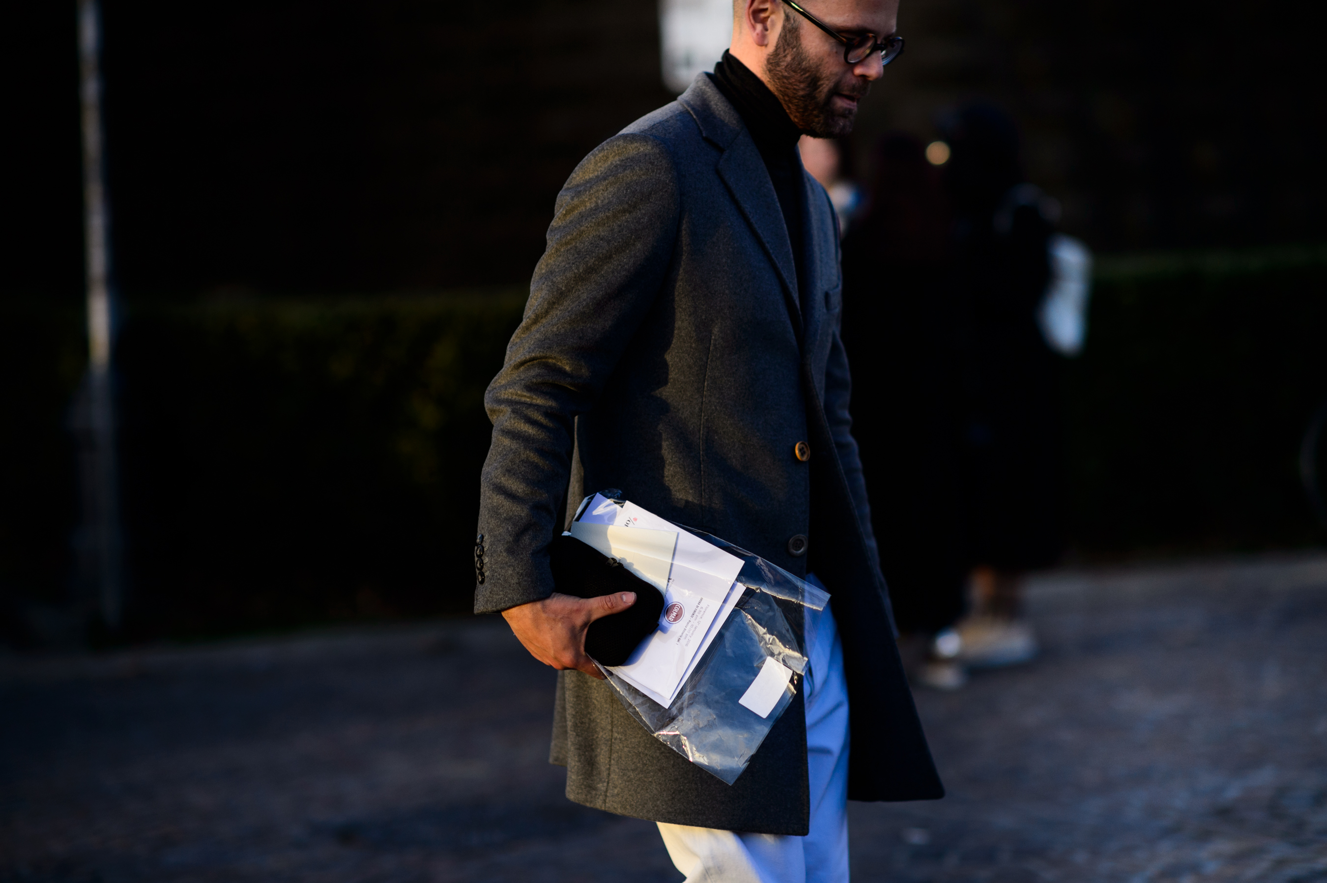 Fashion journalist wearing grey coat