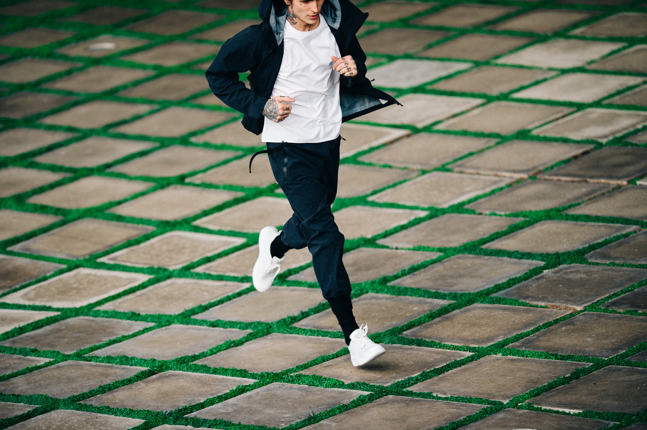 Male model with tattoos running