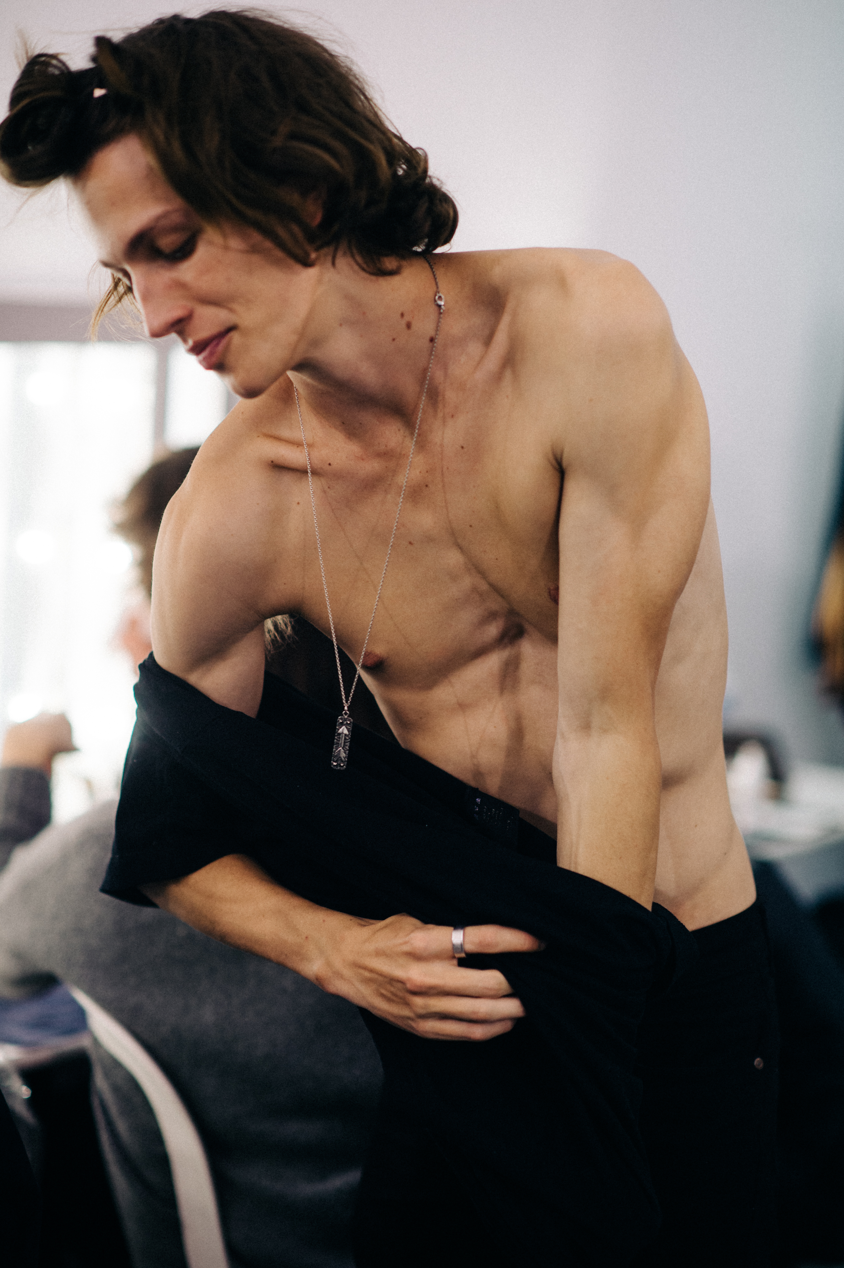 Male model getting dressed