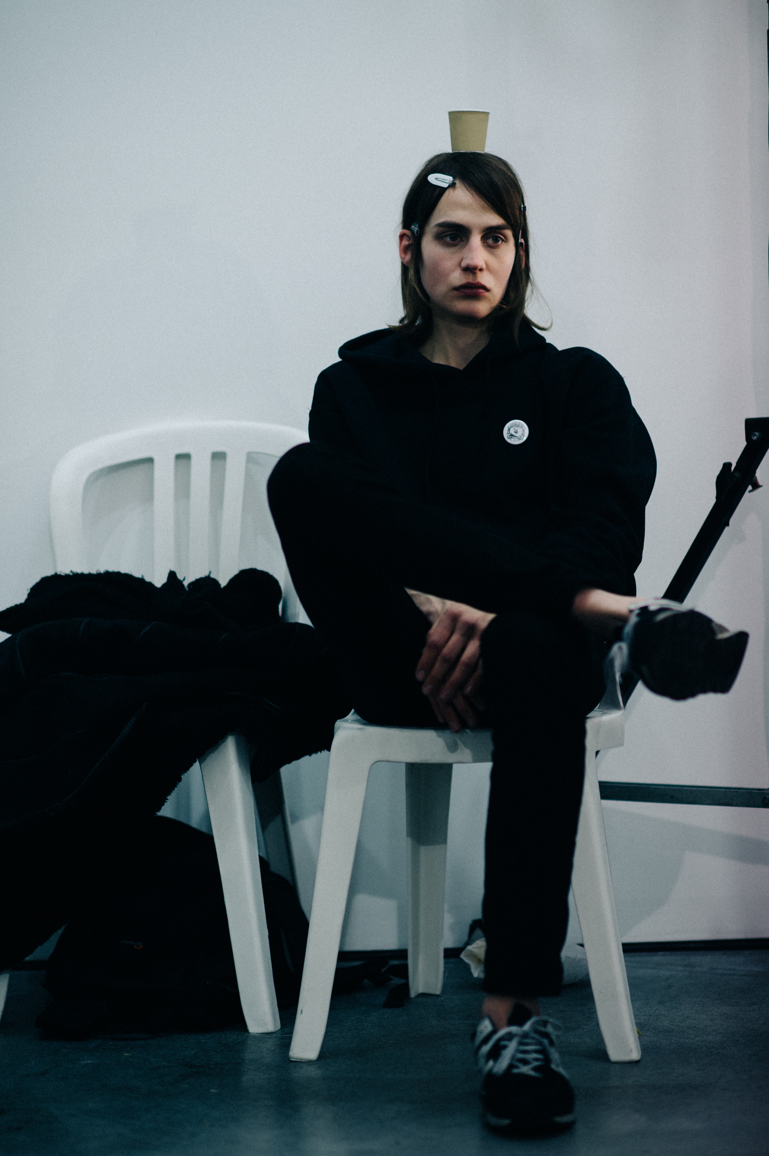 Male model with cup on head
