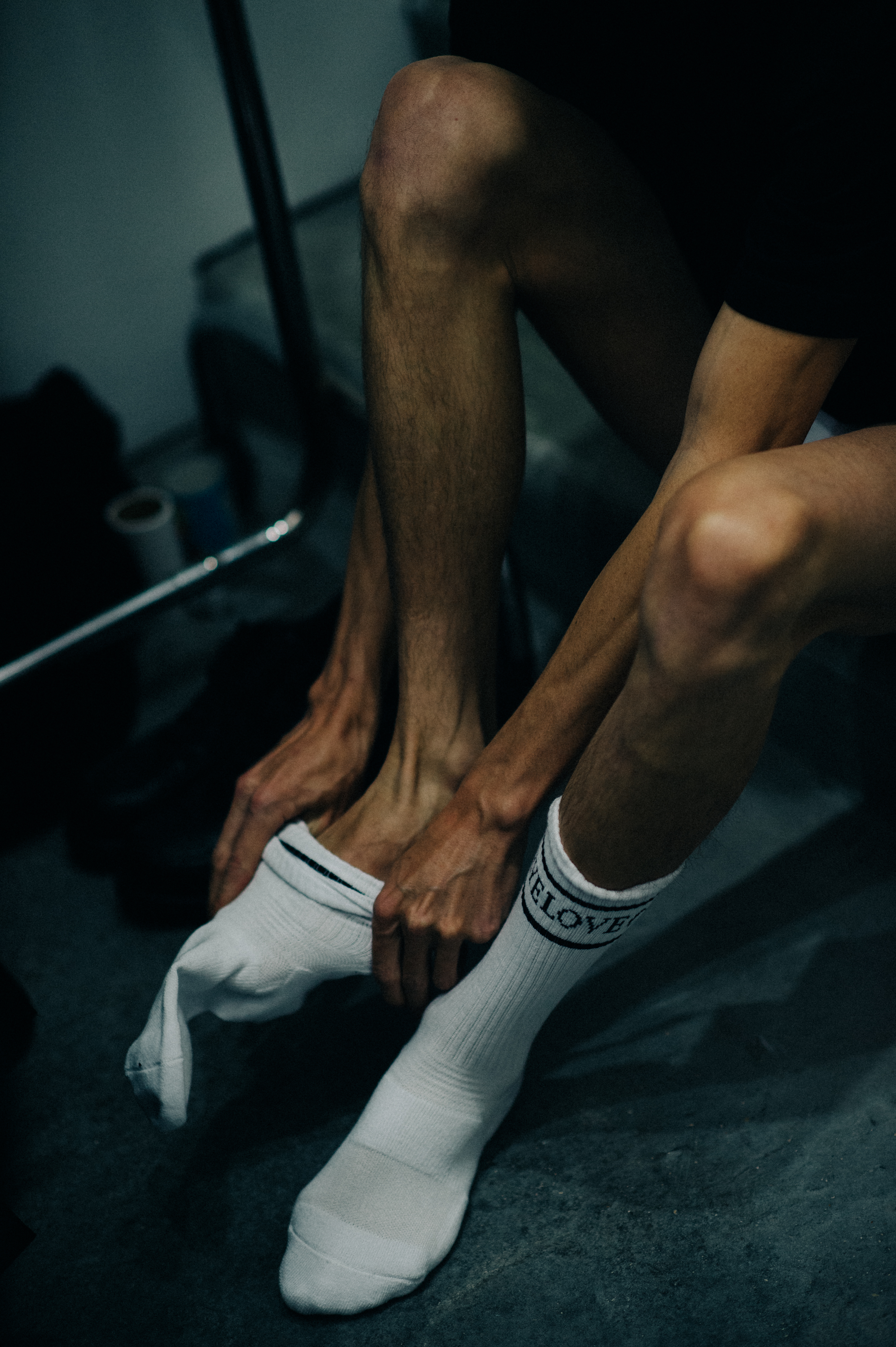 Male model getting socks on