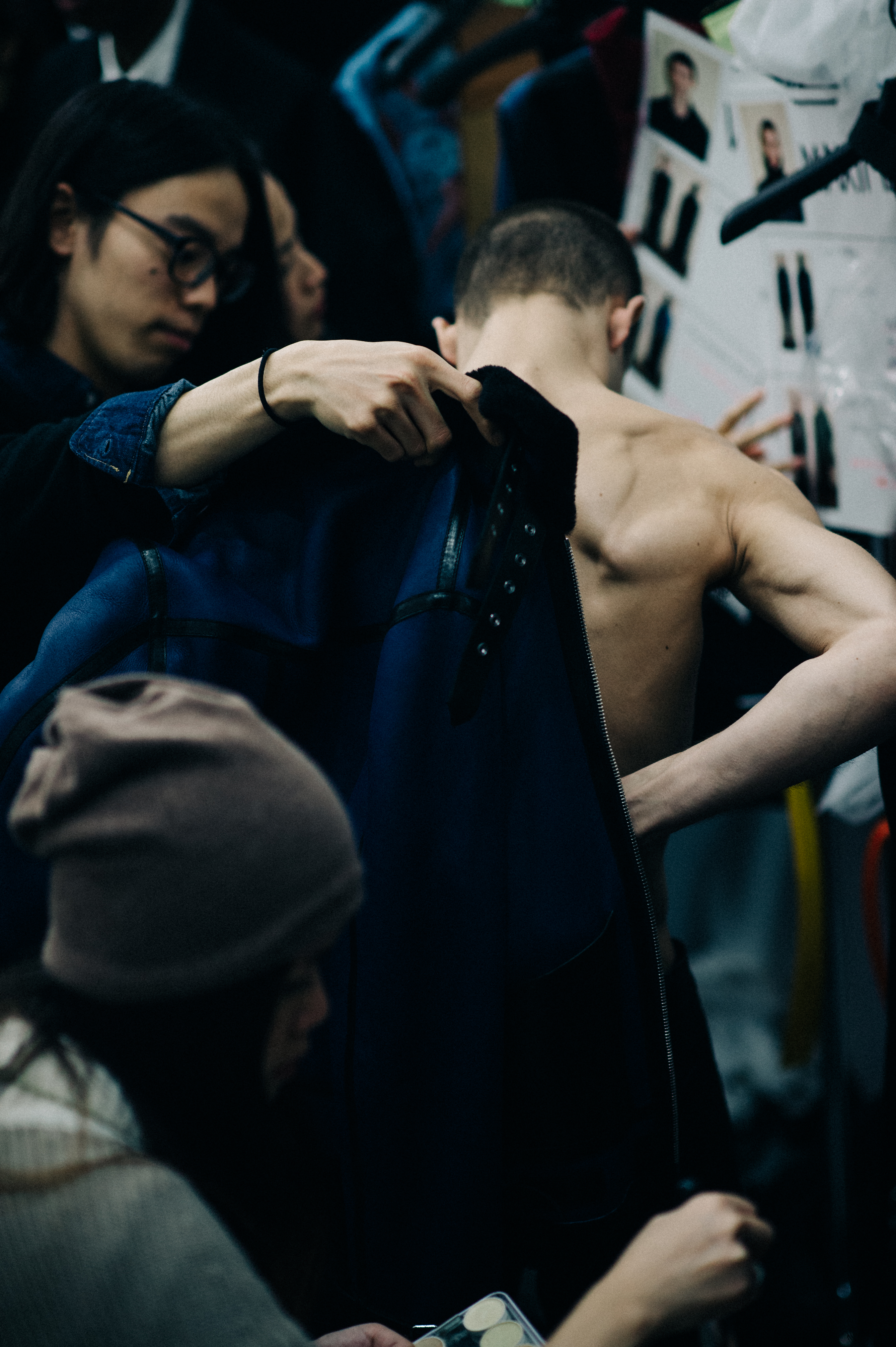 Male model getting dressed