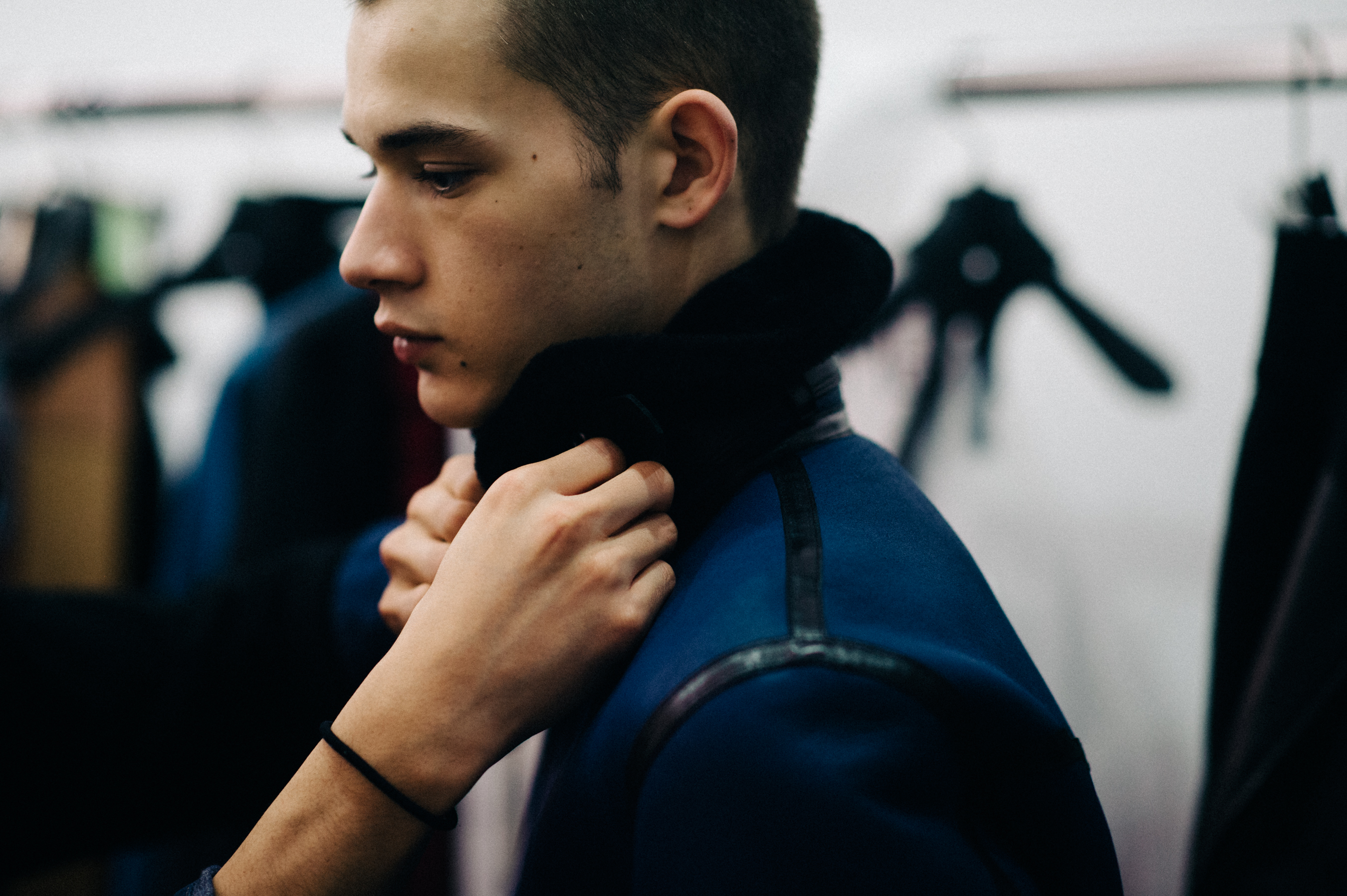 Male model getting dressed