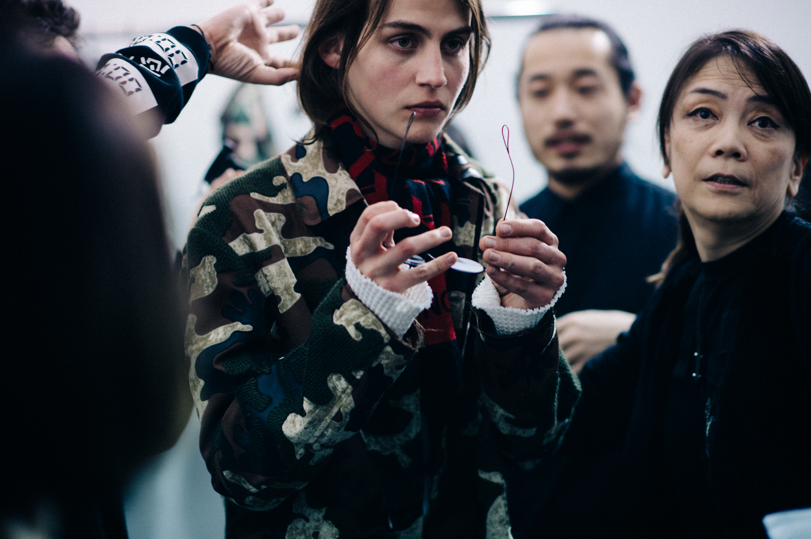 Male model getting dressed