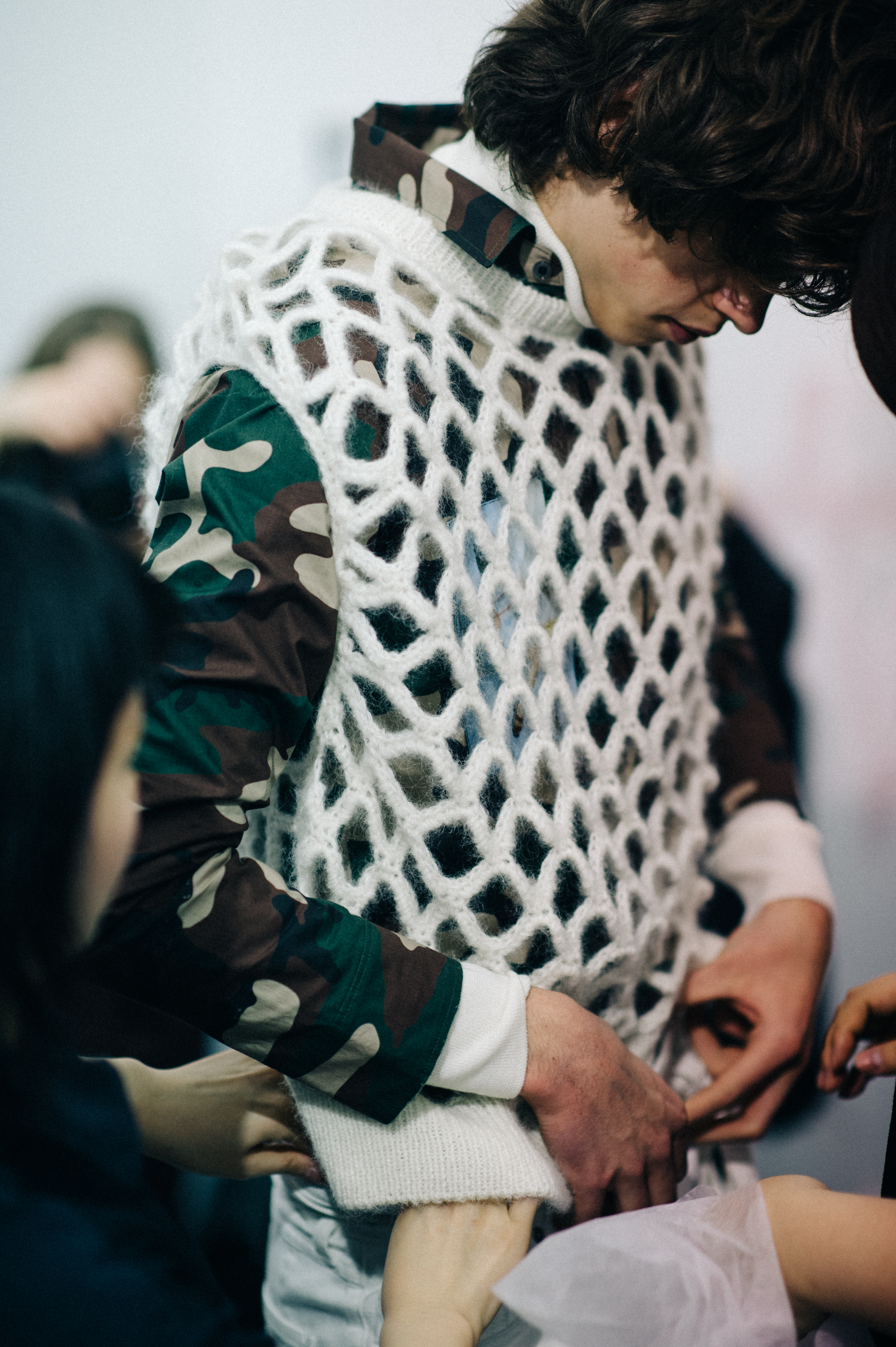 Male model getting dressed