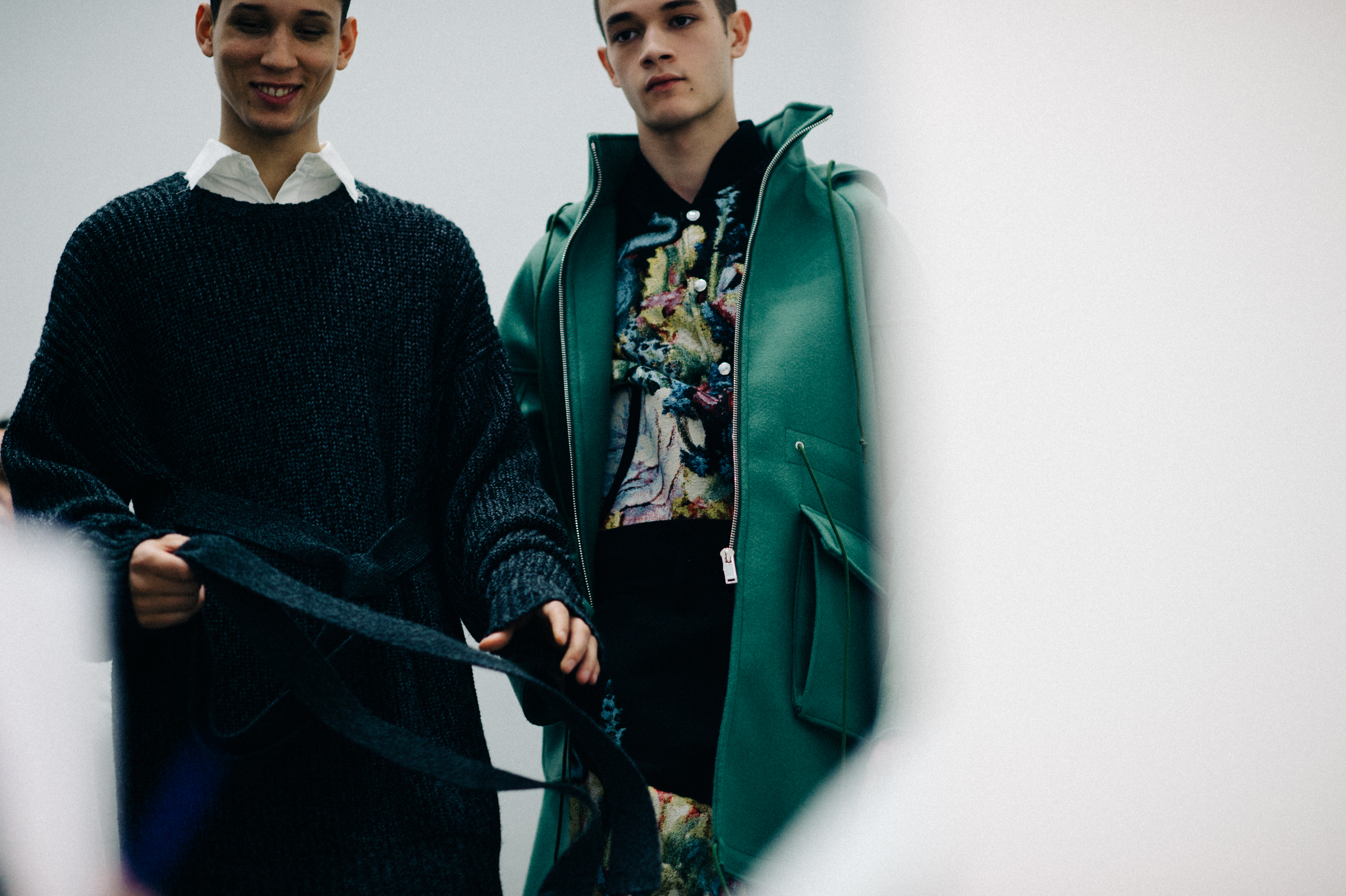 Two male models smiling