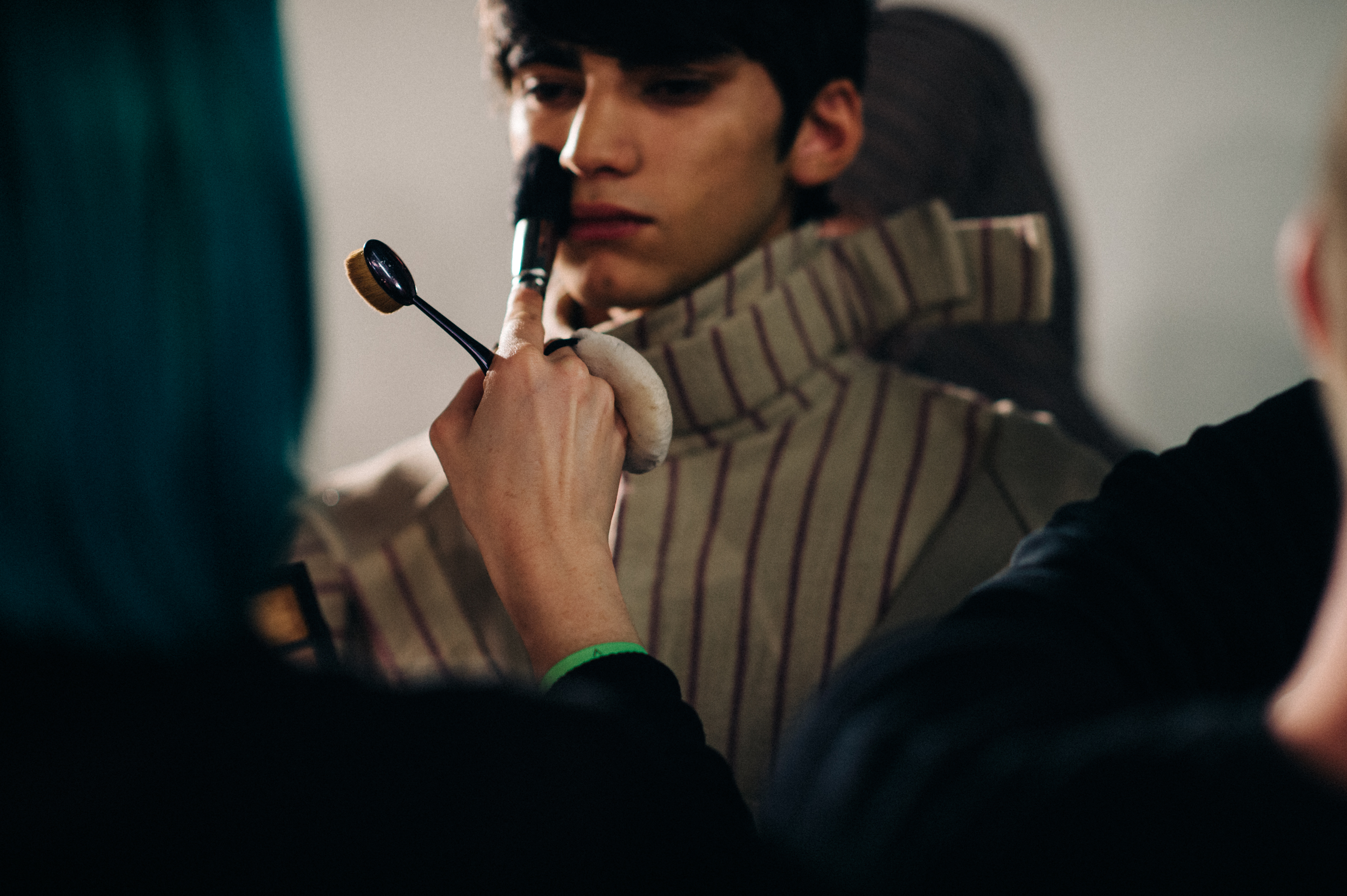 Male model getting make up